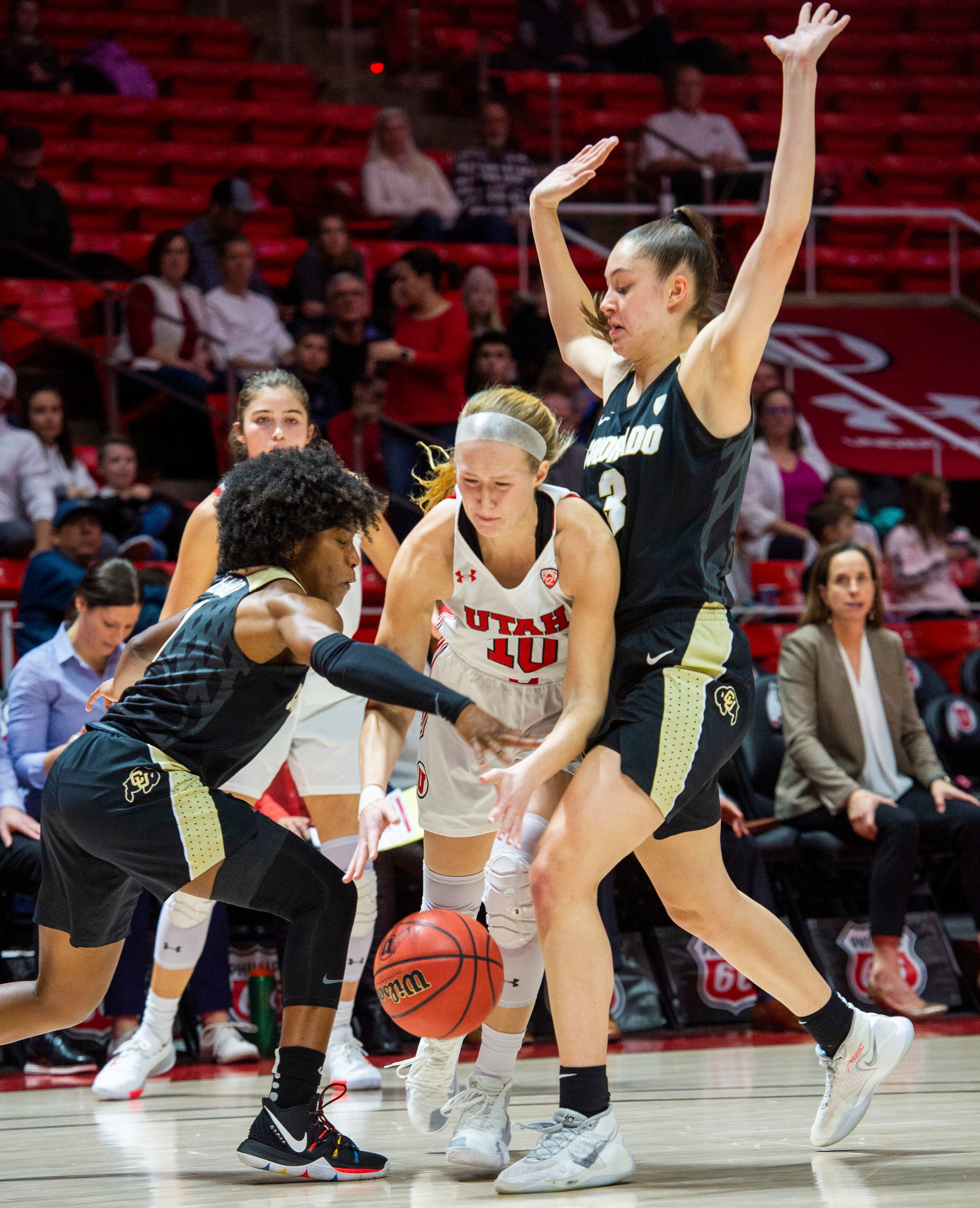 (Rick Egan | The Salt Lake Tribune) Utah Utes guard Dru Gylten (10) dribbles between Colorado Buffaloes guard Jaylyn Sherrod (1) and Colorado Buffaloes guard Emma Clarke (3), in PAC-12 basketball action between the Utah Utes and the Colorado Buffaloes, at the Jon M. Huntsman Center, Sunday, Nov. 29, 2019.