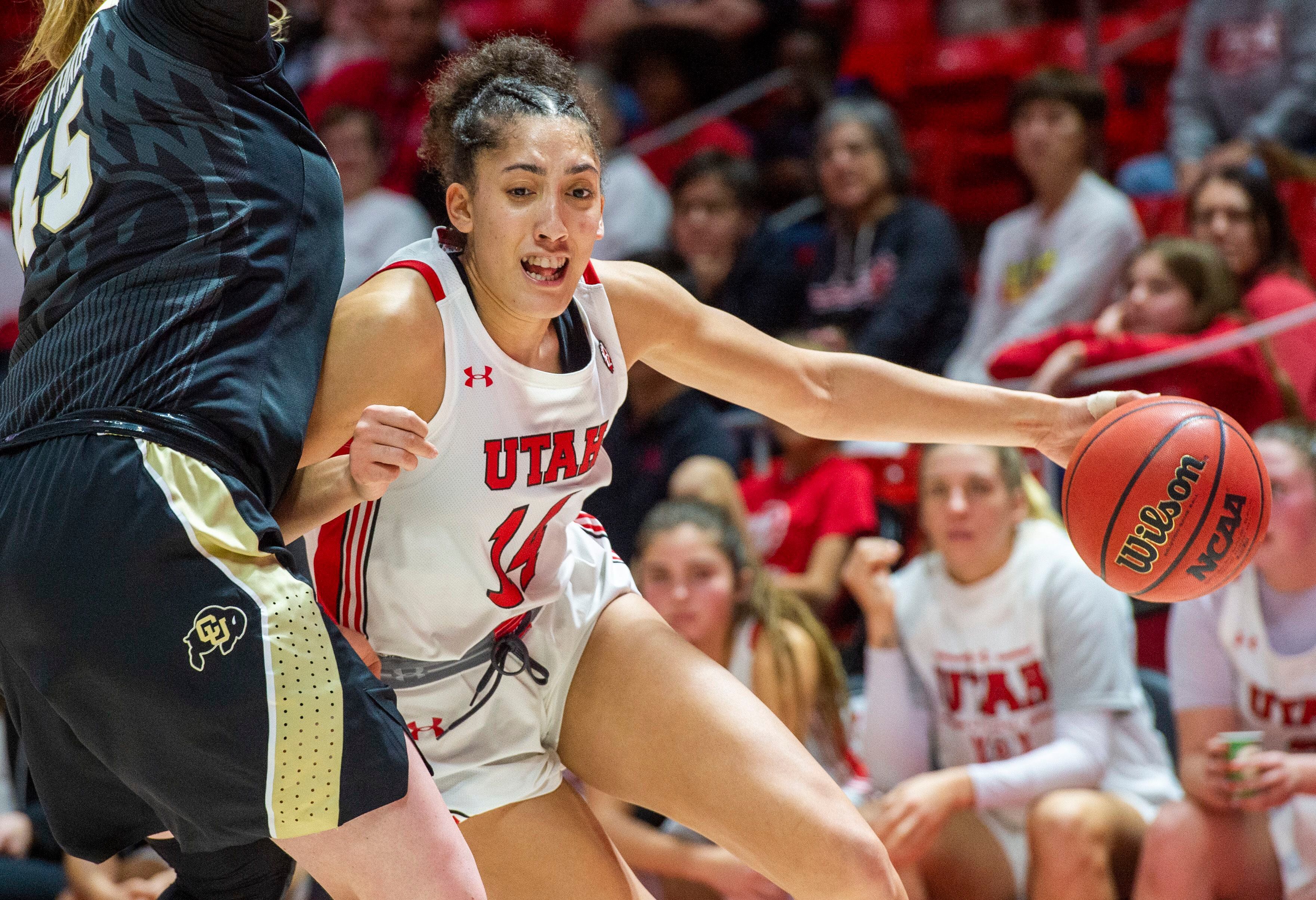 (Rick Egan | The Salt Lake Tribune) Colorado Buffaloes forward Charlotte Whittaker (45) defends, as Utah guard Niyah Becker (14) takes he ball inside, in PAC-12 basketball action between the Utah Utes and the Colorado Buffaloes, at the Jon M. Huntsman Center, Sunday, Nov. 29, 2019.