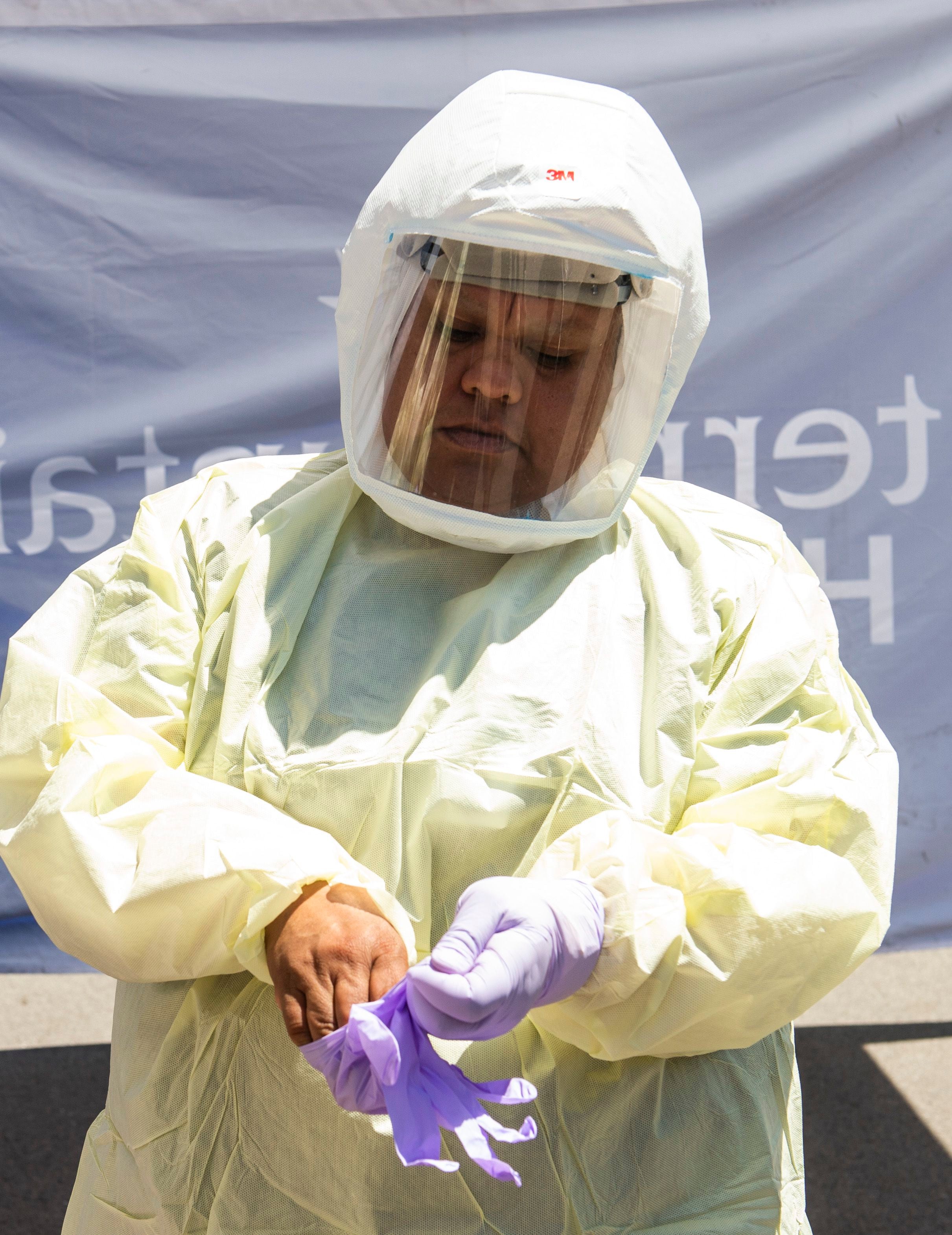 (Rick Egan | The Salt Lake Tribune) Intermountain Healthcare medical assistant, Latoya Dovila, prepares for the next test at the Intermountain Healthcare Coronavirus Mobile Testing Unit at Utah Valley Hospital in Provo, Friday May 8, 2020.