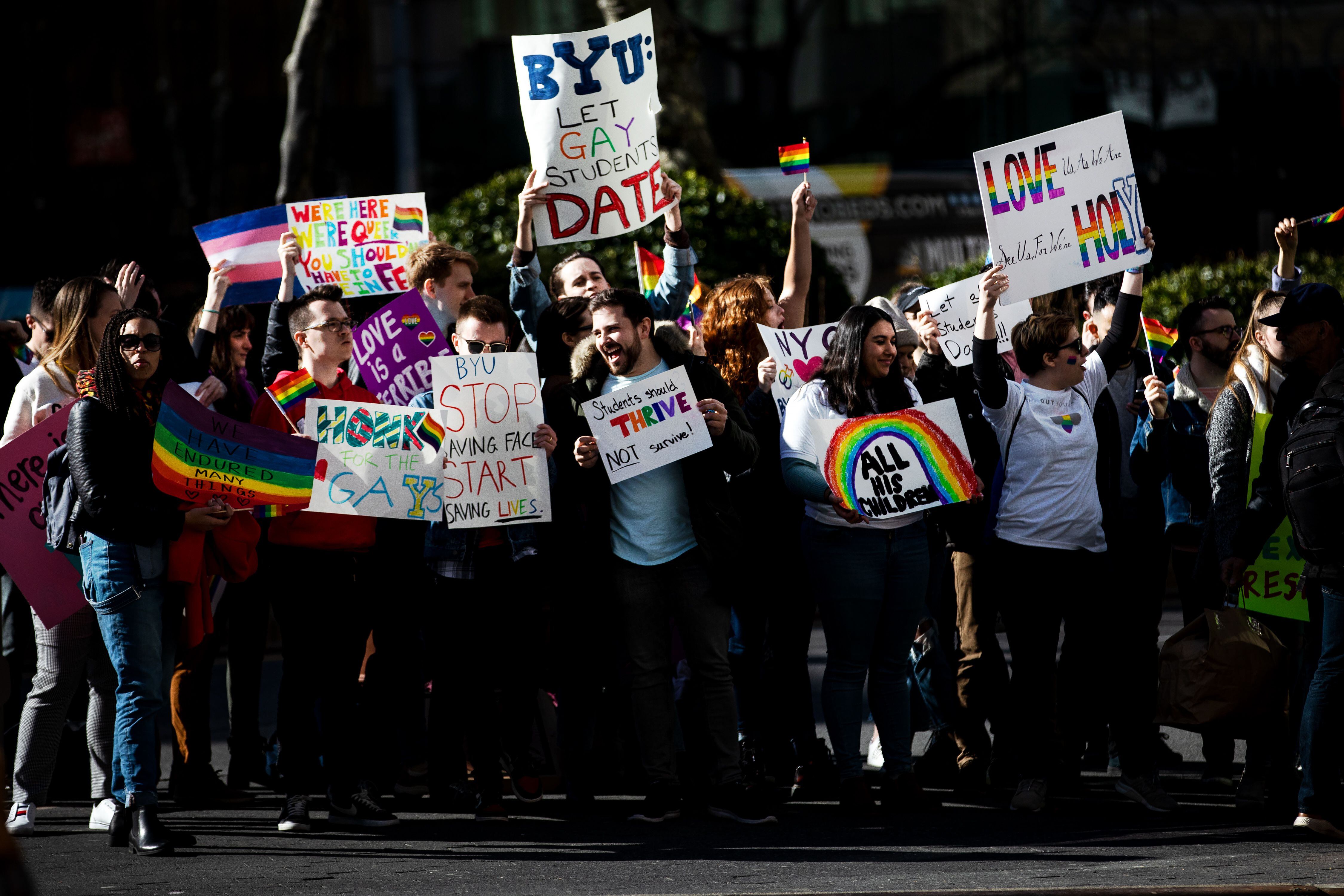 (Demetrius Freeman | for The Salt Lake Tribune) Current and former members of the Church of Jesus Christ of Latter-day Saints, the LGBTQ+ community, and supporters gather at Lincoln square across from the Mormon temple in Manhattan, New York, on March 7, 2020, to stand in solidarity with LGBTQ+ students who attending Brigham Young University. Brigham Young University reinstated homophobic policies in their student handbook that prohibit Òhomosexual behavior.Ó