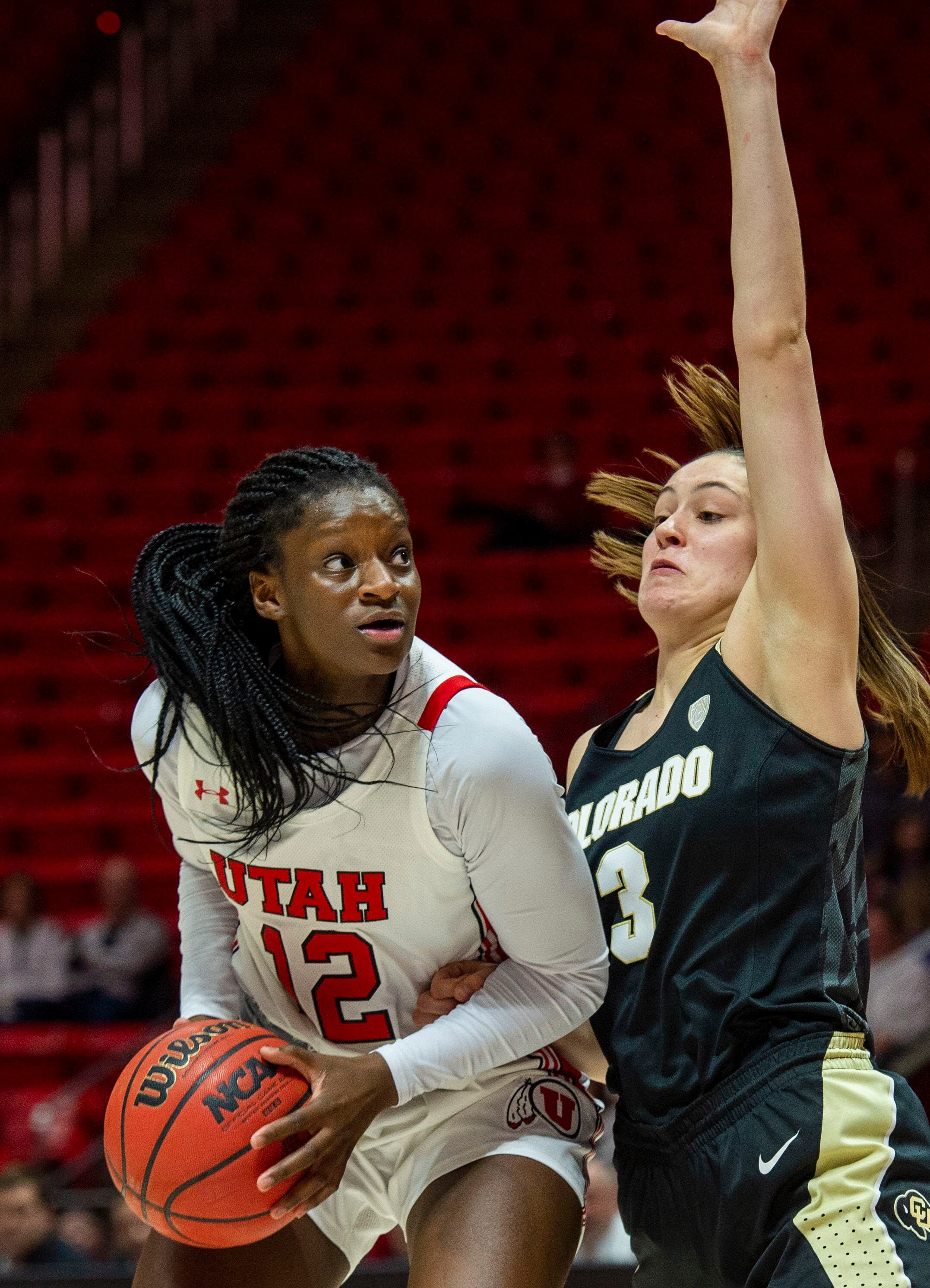 (Rick Egan | The Salt Lake Tribune) Utah Utes forward Lola Pendande (12) looks for a shot, as Colorado Buffaloes guard Emma Clarke (3) defends, in PAC-12 basketball action between the Utah Utes and the Colorado Buffaloes, at the Jon M. Huntsman Center, Sunday, Nov. 29, 2019.