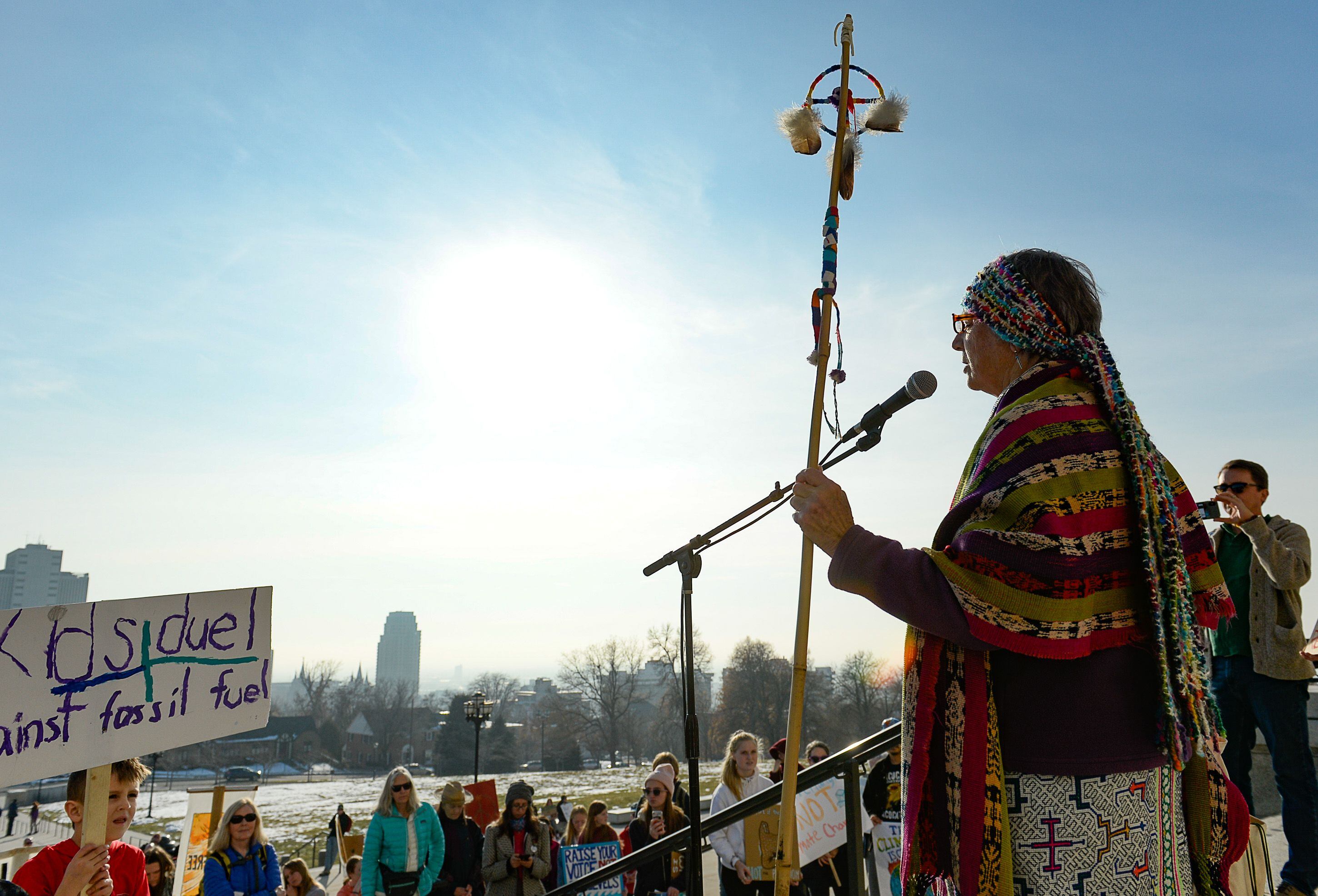 (Francisco Kjolseth | The Salt Lake Tribune) Patricia Davidson sings a message to represent the elders and their support of youth striking for climate action as Fridays For Future, Utah Youth Environmental Solutions, and partners gather in opposition to UtahÕs final oil and gas lease sale of 2019 that will auction off public lands and further fossil fuel development during a rally on the steps of the Utah Capitol on Friday, Dec. 6, 2019.