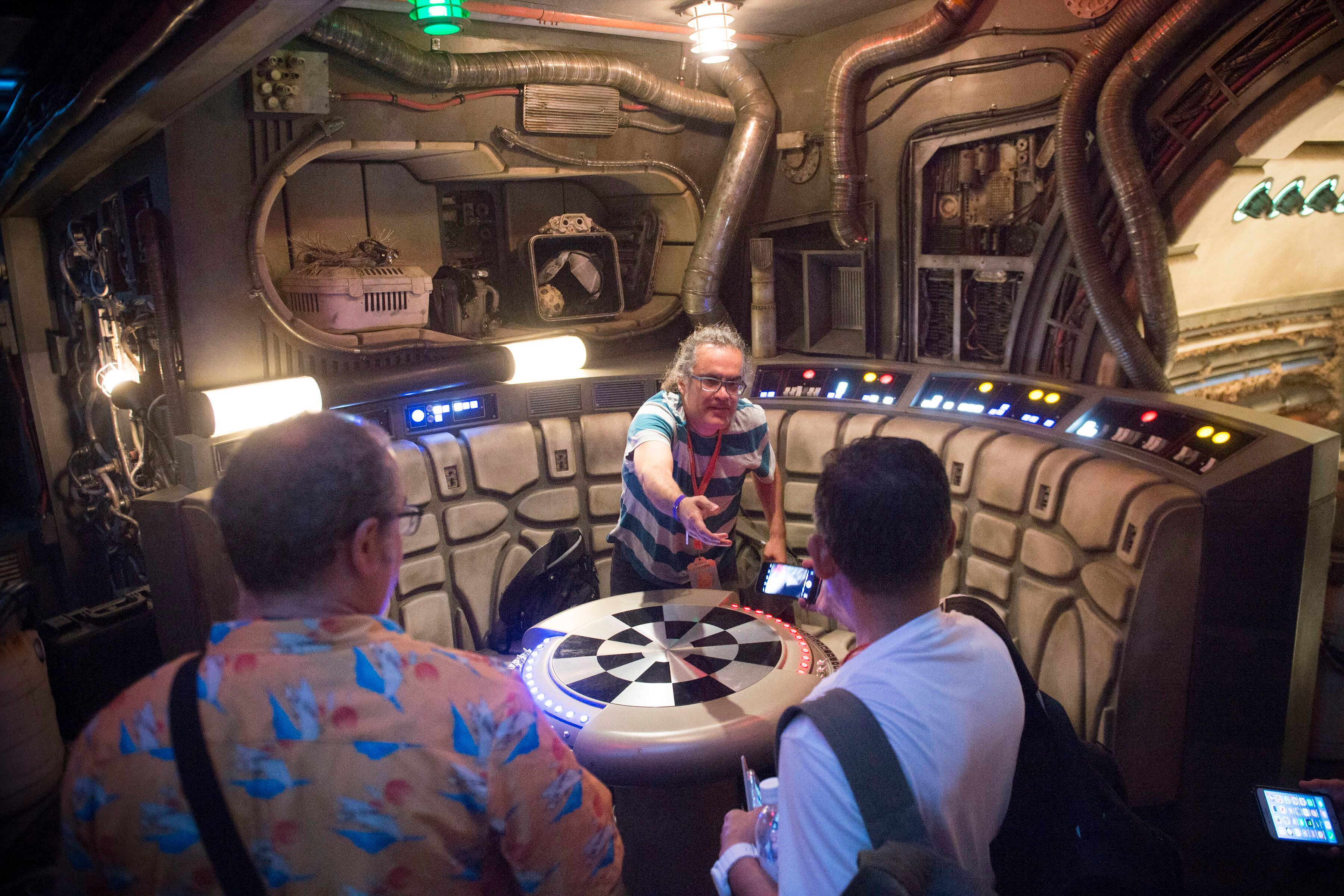 (Jeremy Harmon | The Salt Lake Tribune) Visitors take photos in the chess room on board the Millennium Falcon as they wait their turn to fly the ship at Star Wars: Galaxy's Edge in Anaheim, Ca. on Wednesday, May 29, 2019.