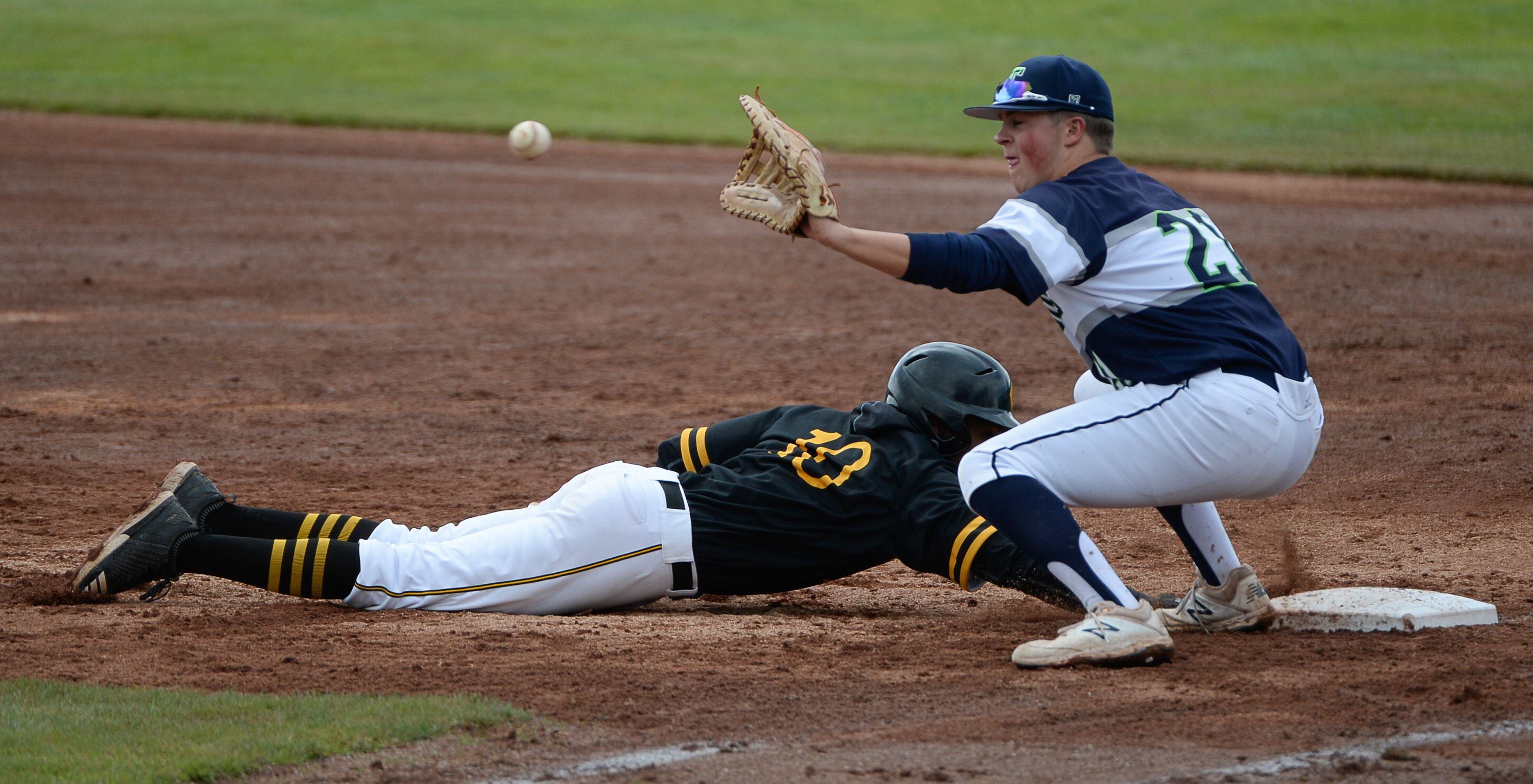 (Francisco Kjolseth | The Salt Lake Tribune) Daniel Gonzales manages to get safely back to first at Paxton Richards stays ready at first during the 5A baseball championship game at UCCU Stadium on the UVU campus in Orem, Friday, May 24, 2019.