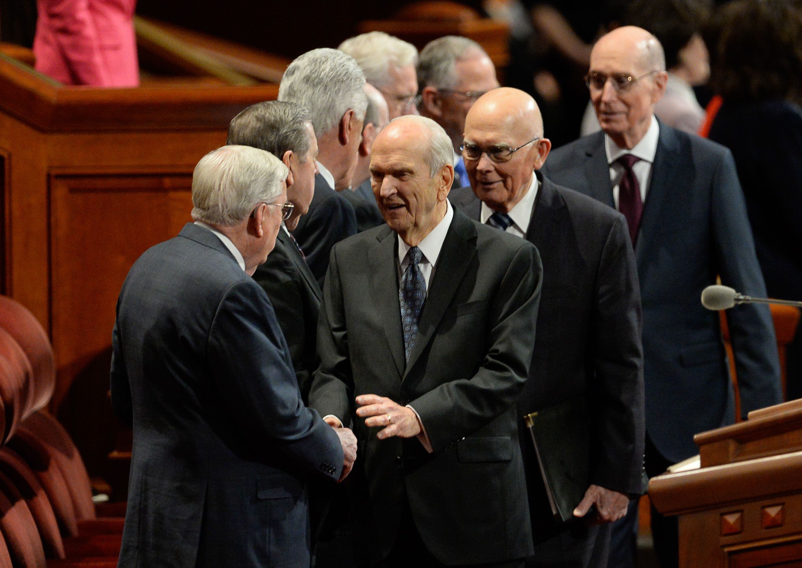 (Francisco Kjolseth | The Salt Lake Tribune) President Russell M. Nelson, center, greets President M. Russell Ballard, acting president of the Quorum of the Twelve Apostles while followed by President Dallin H. Oaks, first counselor in the First Presidency and Henry B. Eyring, second counselor in the First Presidency for the start of the Sunday afternoon session of the 189th twice-annual General Conference of The Church of Jesus Christ of Latter-day Saints at the Conference Center in Salt Lake City on Sunday, Oct. 6, 2019.