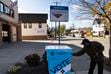 (Lauren Justice | The New York Times) A man uses a ballot drop box at a fire station in Madison, Wis., on Nov. 1, 2020. Wide use of the boxes in that election prompted conservative efforts to restrict them.