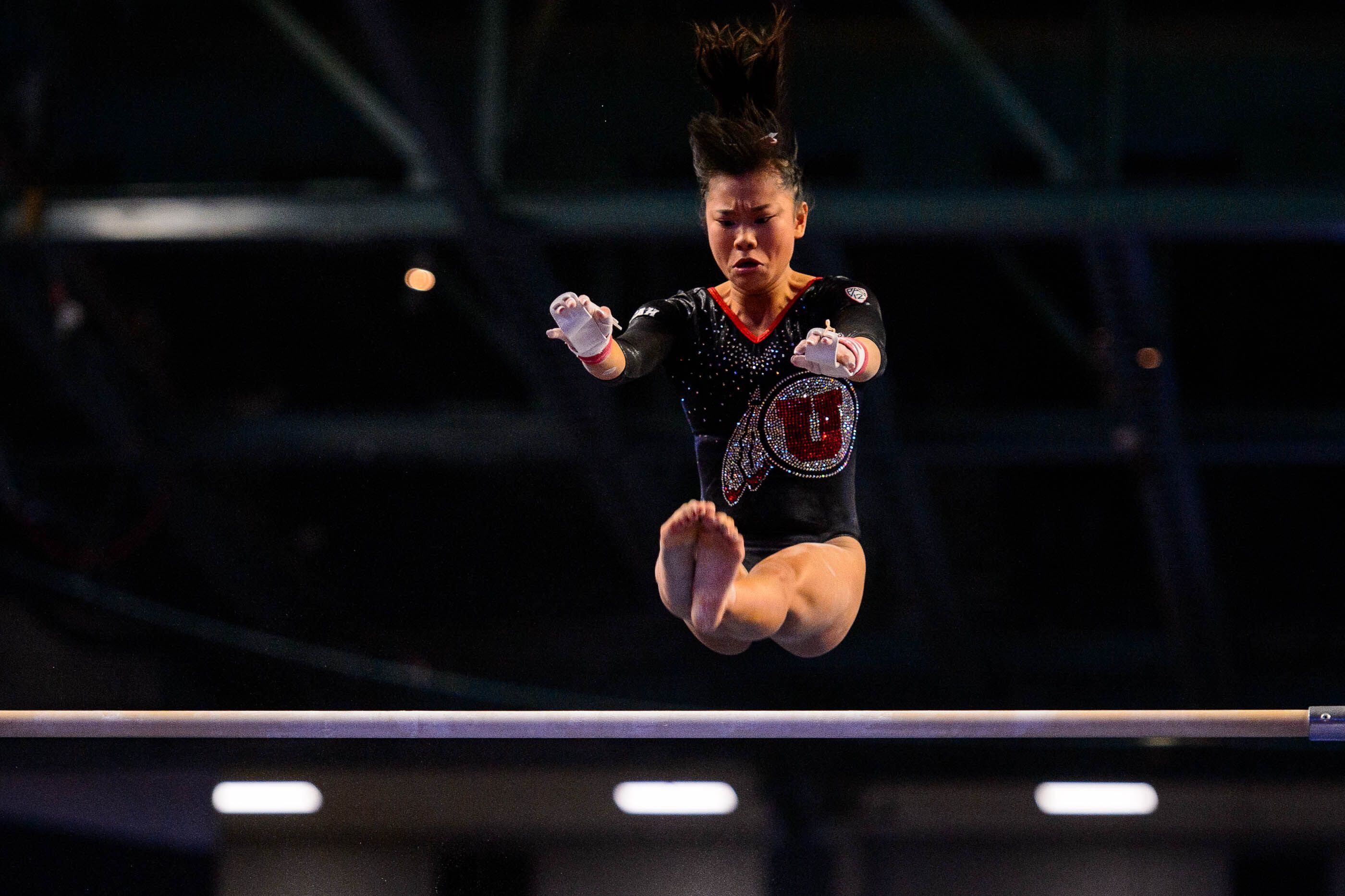 (Trent Nelson | The Salt Lake Tribune) Utah's Kim Tessen on the bars at the Best of Utah NCAA Gymnastics Meet in West Valley City on Saturday, Jan. 11, 2020.