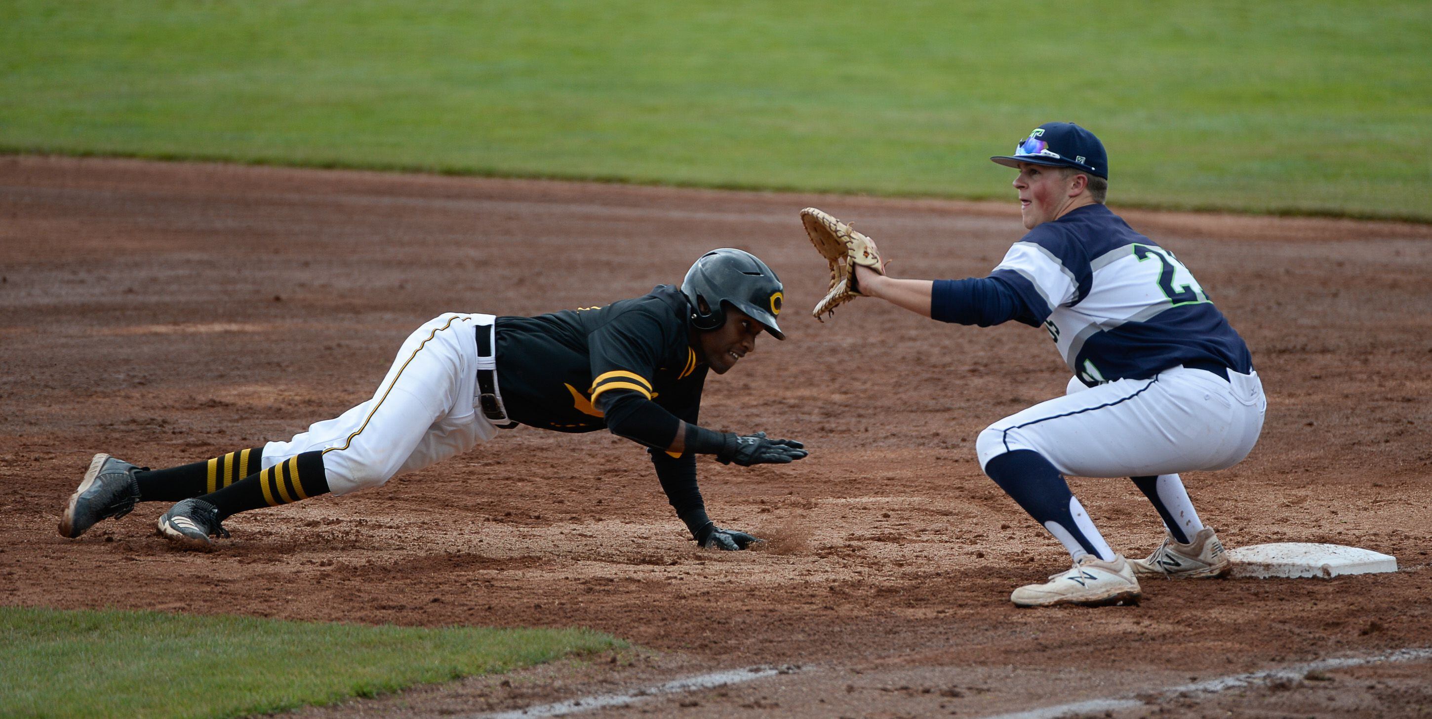 (Francisco Kjolseth | The Salt Lake Tribune) Daniel Gonzales manages to get safely back to first at Paxton Richards stays ready at first during the 5A baseball championship game at UCCU Stadium on the UVU campus in Orem, Friday, May 24, 2019.