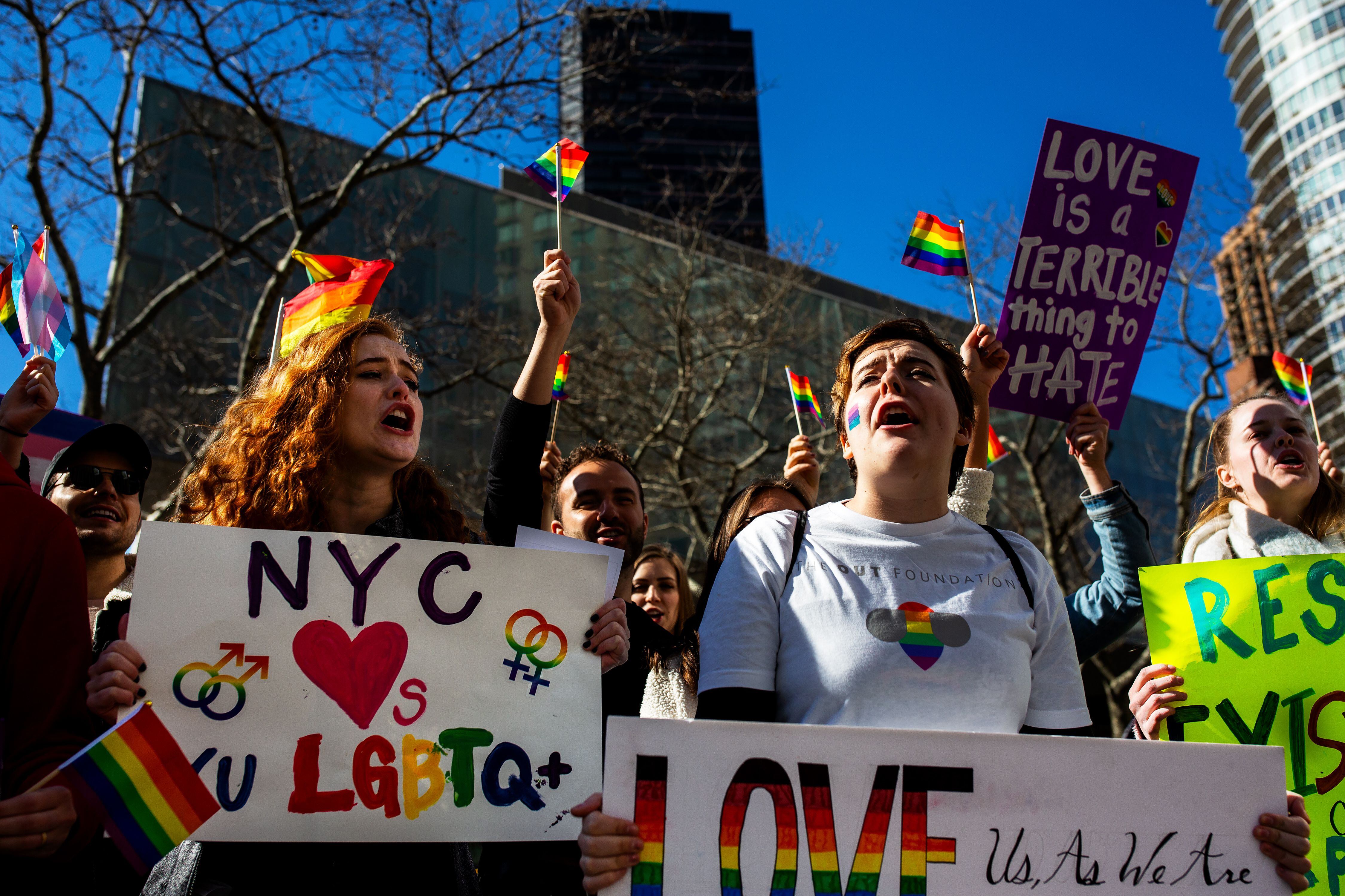 (Demetrius Freeman | for The Salt Lake Tribune) Maddie Hall, 25, left, and Sarah Morris chant with current and former members of The Church of Jesus Christ of Latter-day Saints, the LGBTQ+ community, and supporters demonstrate at Lincoln Square across from the Latter-day Saints temple in Manhattan on Saturday, March 7, 2020. BYU reinstated policies in its student handbook that prohibit "homosexual behavior."