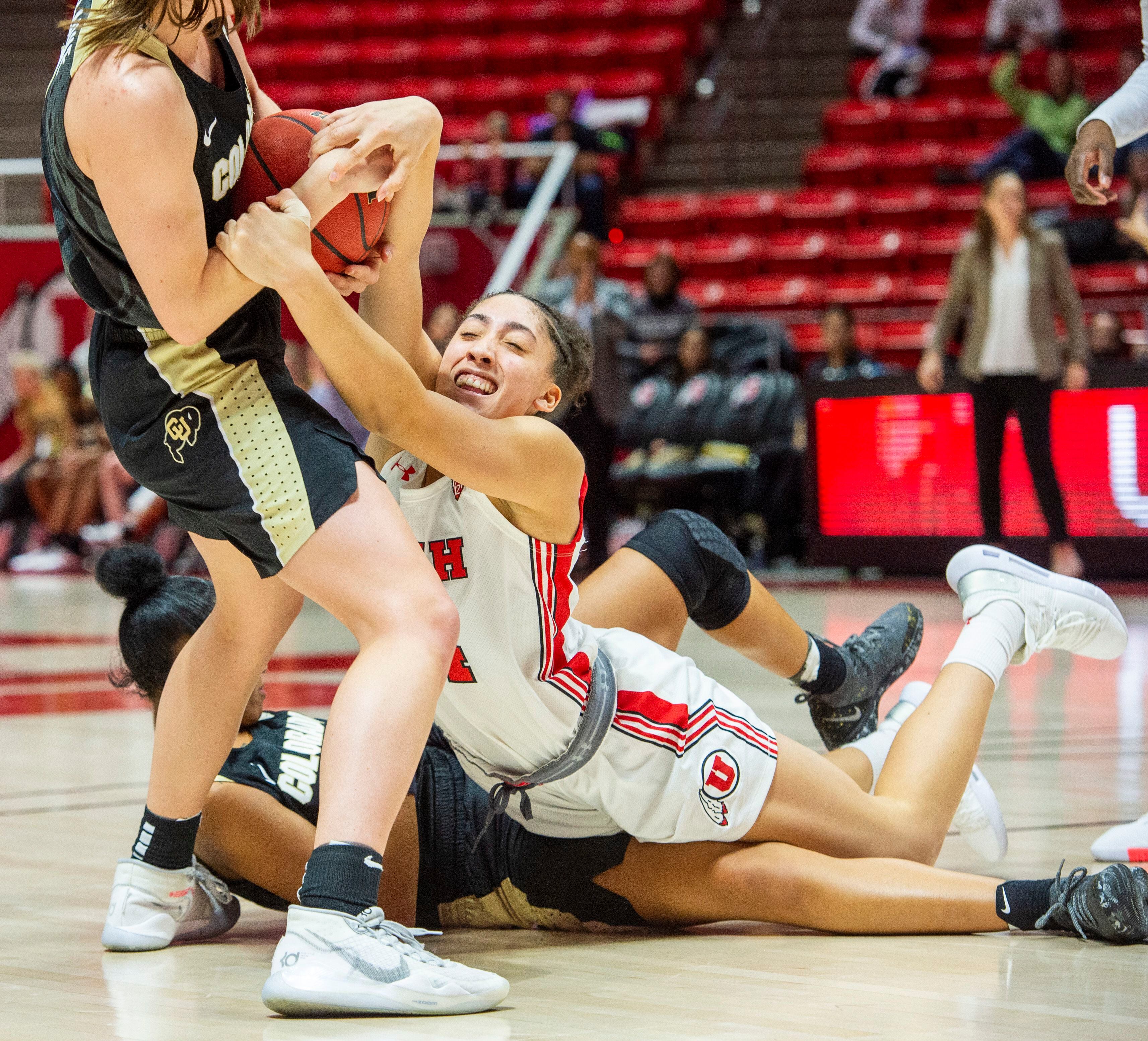 (Rick Egan | The Salt Lake Tribune) Utah Utes guard Niyah Becker (14) tries to grab the ball from Colorado Buffaloes guard Emma Clarke (3), in PAC-12 basketball action between the Utah Utes and the Colorado Buffaloes, at the Jon M. Huntsman Center, Sunday, Nov. 29, 2019.