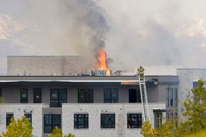(Chris Samuels | The Salt Lake Tribune) Emergency crews continue to respond to a four-alarm fire in a new construction of apartment residences in Sugar House, Wednesday, Oct. 26, 2022. The massive fire first ignited late Tuesday.