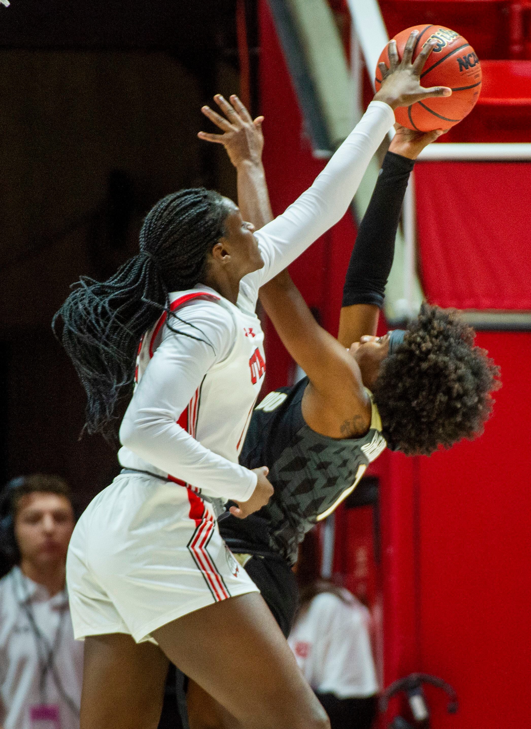 (Rick Egan | The Salt Lake Tribune) Utah Utes forward Lola Pendande (12) blocks a shot by Colorado Buffaloes guard Jaylyn Sherrod (1), in PAC-12 basketball action between the Utah Utes and the Colorado Buffaloes, at the Jon M. Huntsman Center, Sunday, Nov. 29, 2019.