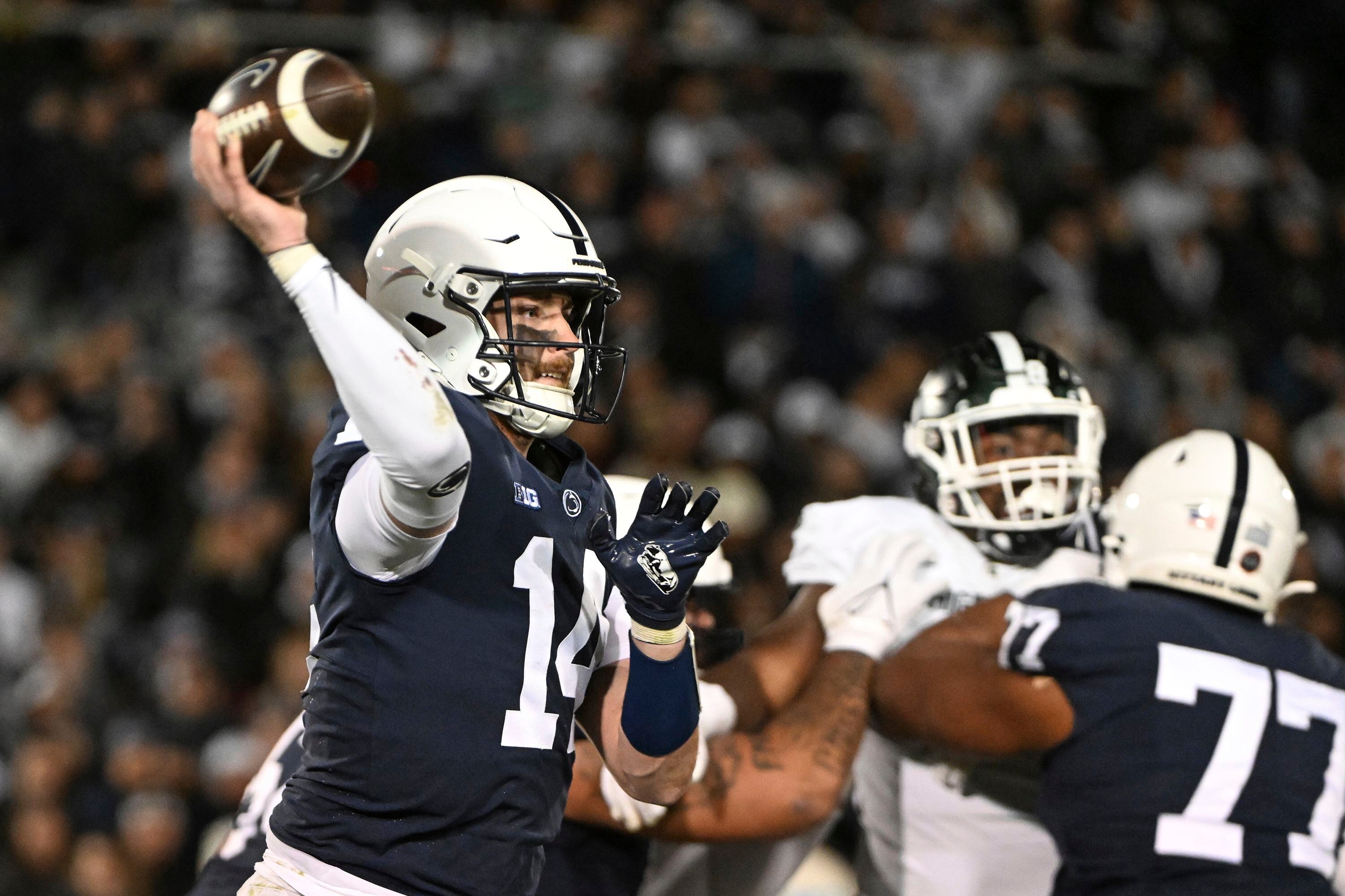 (Barry Reeger | AP) Penn State quarterback Sean Clifford (14) throws a pass during the second half of an NCAA college football game, against Michigan State, Saturday, Nov. 26, 2022, in State College, Pa.