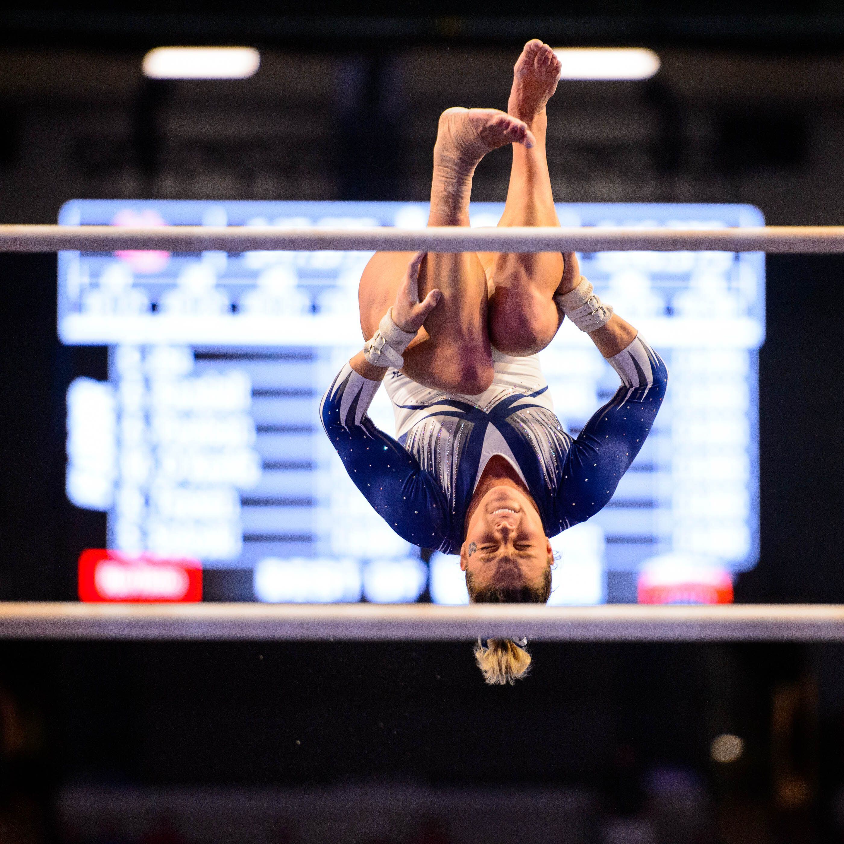 (Trent Nelson | The Salt Lake Tribune) Utah State's Leighton Varnadore on the bars at the Best of Utah NCAA Gymnastics Meet in West Valley City on Saturday, Jan. 11, 2020.