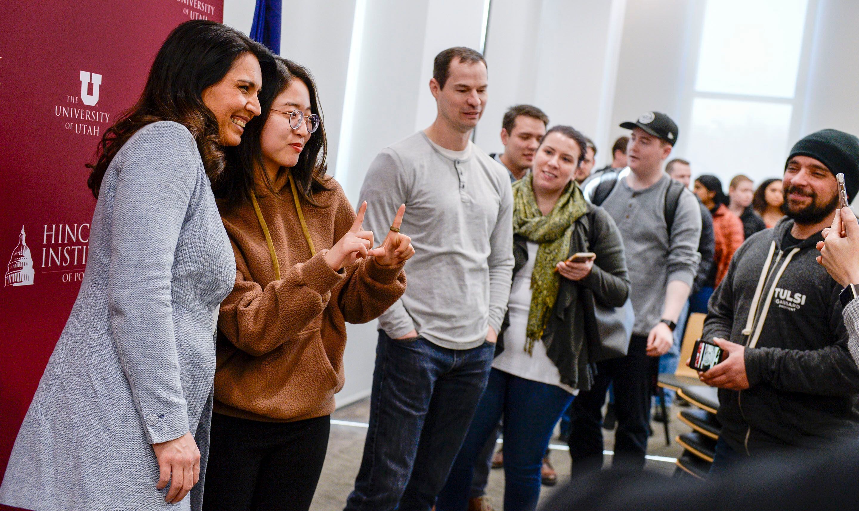 (Leah Hogsten | The Salt Lake Tribune) A long line of people waited to greet Tulsi Gabbard on Friday and snap a quick cell phone picture. Tulsi Gabbard, U.S. Representative for Hawaii' and Democratic presidential candidate, delivers her stump speech at a "meet the candidate" event at the University of Utah's Hinckley Institute of Politics, Feb. 21, 2020.