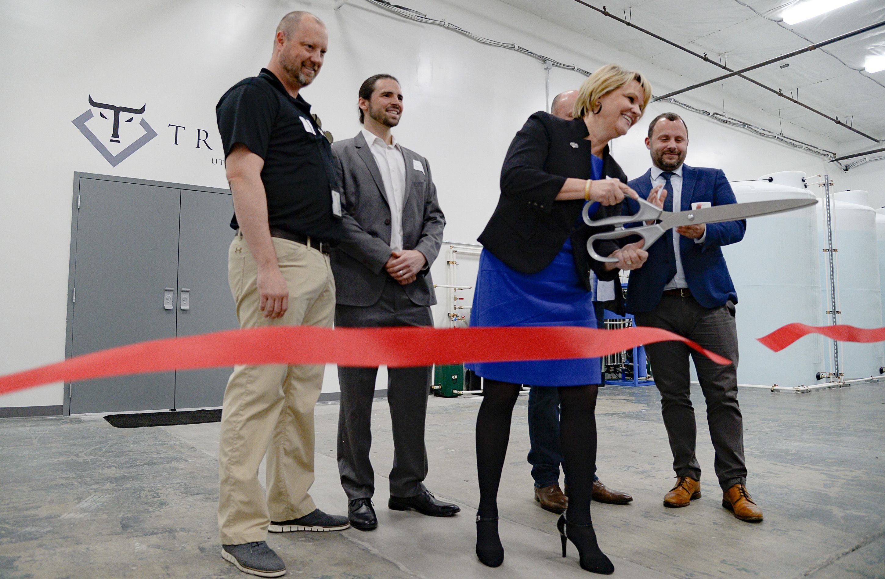 (Francisco Kjolseth | The Salt Lake Tribune) Mayor of Tooele City Debbie Winn cuts the ribbon at Tryke as the company celebrates the grand opening of its cannabis farm in Tooele, on Thursday, Jan. 30, 2020. The company, one of eight cultivators approved by the state, is expected to have product available for patients by March as part of Utah's medical cannabis program.