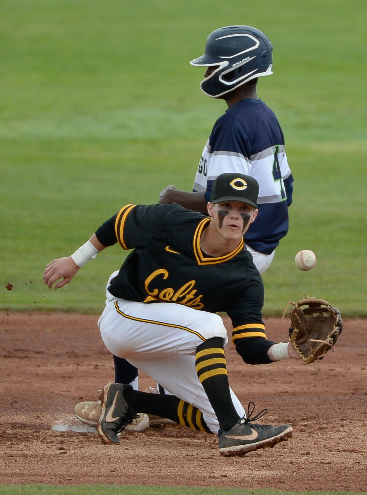 (Francisco Kjolseth | The Salt Lake Tribune) Cade Perkins of Cottonwood keeps his eye on the ball as Will Thomas of Timpanogos slips safely in to second base during the 5A baseball championship game at UCCU Stadium on the UVU campus in Orem, Friday, May 24, 2019.