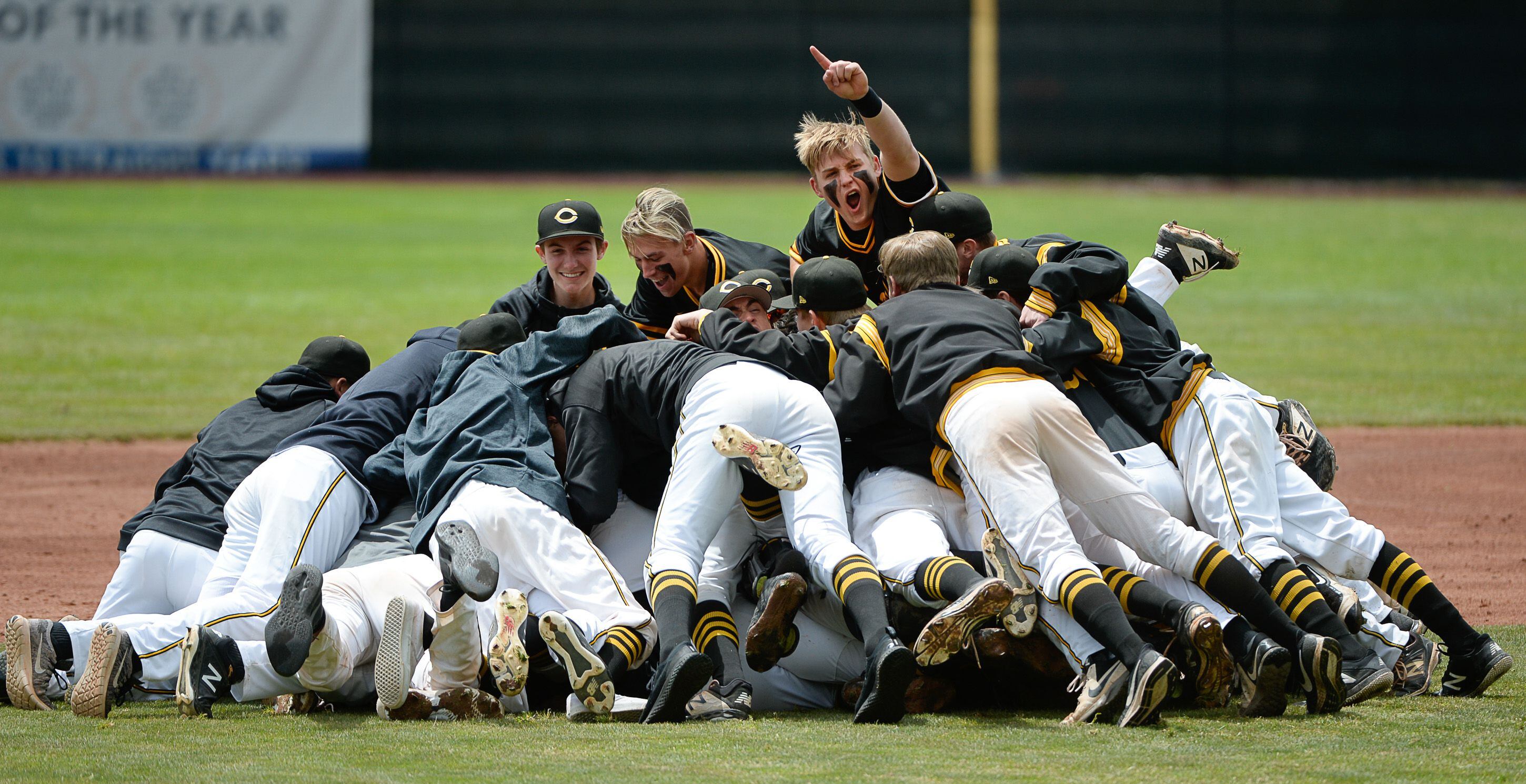 (Francisco Kjolseth | The Salt Lake Tribune) Cottonwood pitcher Carson Angeroth is mobbed by his teammates after striking out Timpanogos in a 6-5 win during the 5A baseball championship game at UCCU Stadium on the UVU campus in Orem, Friday, May 24, 2019.