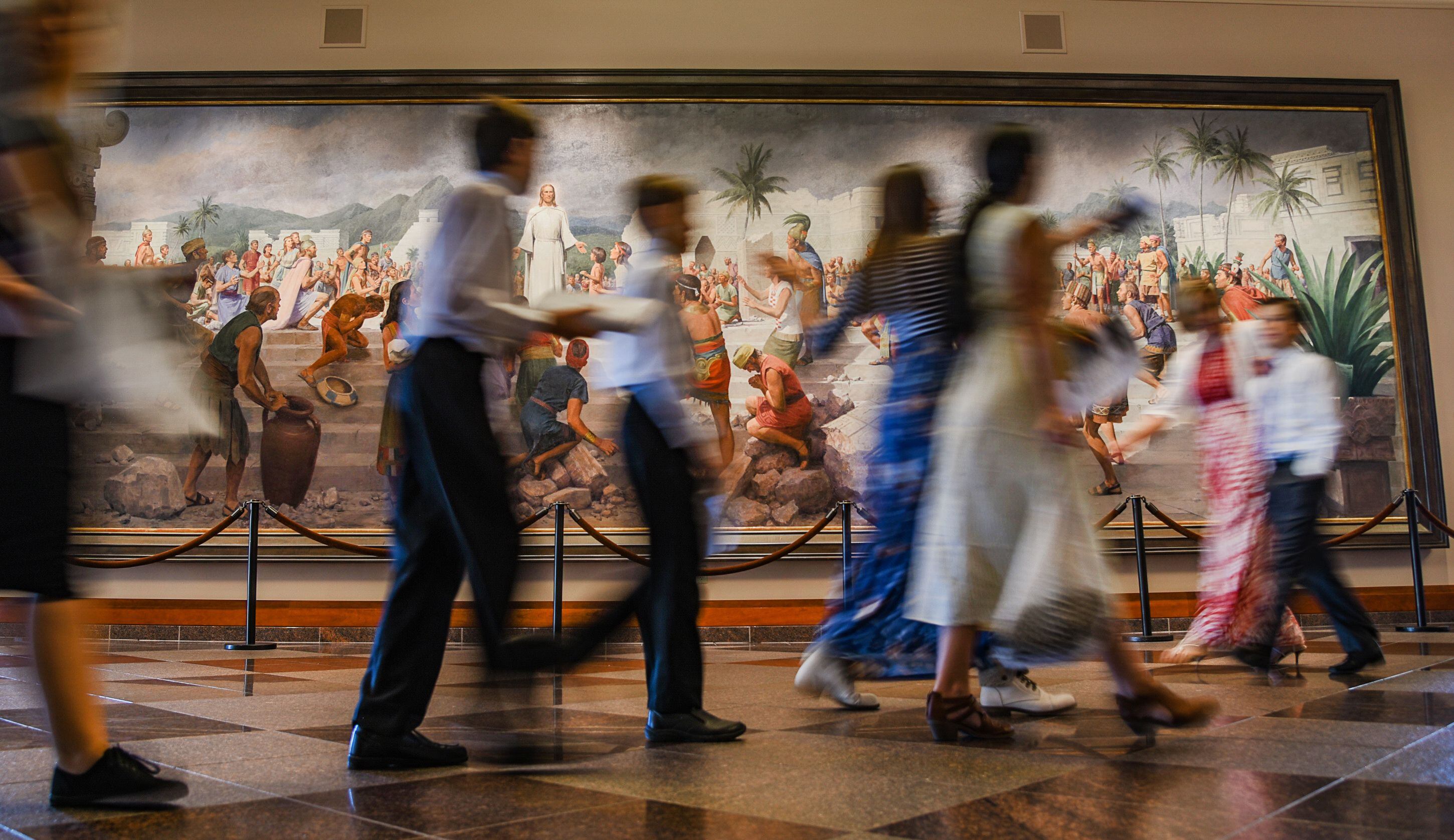 (Francisco Kjolseth | The Salt Lake Tribune) People walk by "Jesus Christ Visits the Americans," by artist John Scott at the Conference Center during the 189th twice-annual General Conference of The Church of Jesus Christ of Latter-day Saints in Salt Lake City on Sunday, Oct. 6, 2019.