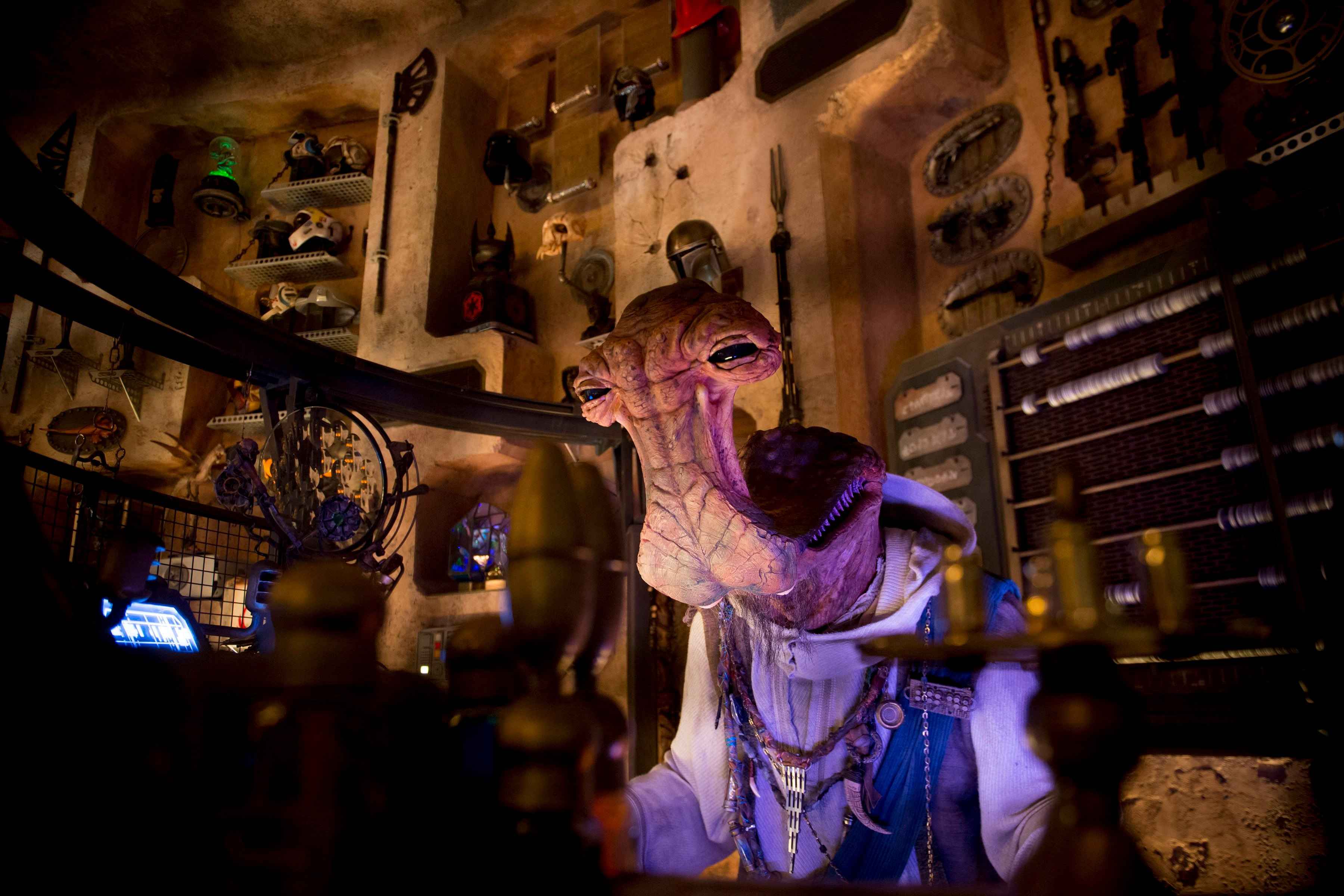 (Jeremy Harmon | The Salt Lake Tribune) Dok-Ondar, an animatronic Ithorian, oversees his Den of Antiquities at Star Wars: Galaxy's Edge in Anaheim, Ca. on Wednesday, May 29, 2019. The shop is full of items fans will recognize from Star Wars films and television shows. 