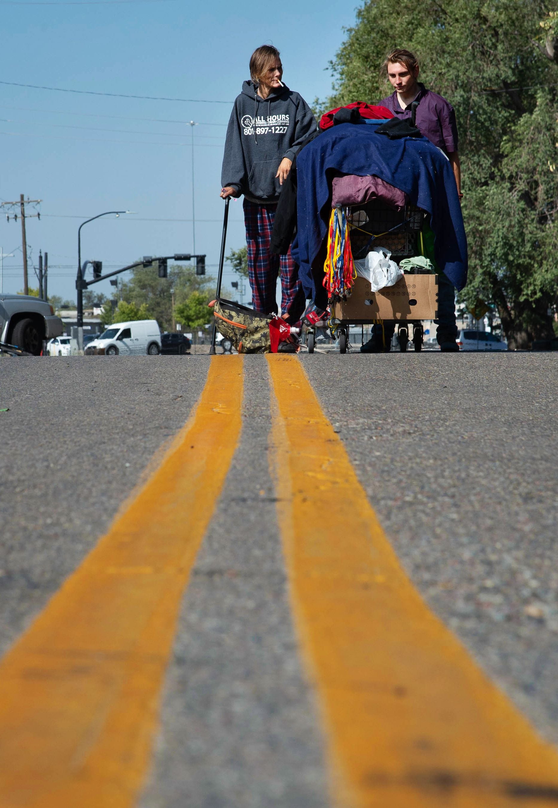 (Francisco Kjolseth | The Salt Lake Tribune) People prepare themselves for plans by the Salt Lake County Health Department to clean up homeless camps on Thursday, Sept. 10, 2020, as they gather their belongings near the former Road Home Shelter.