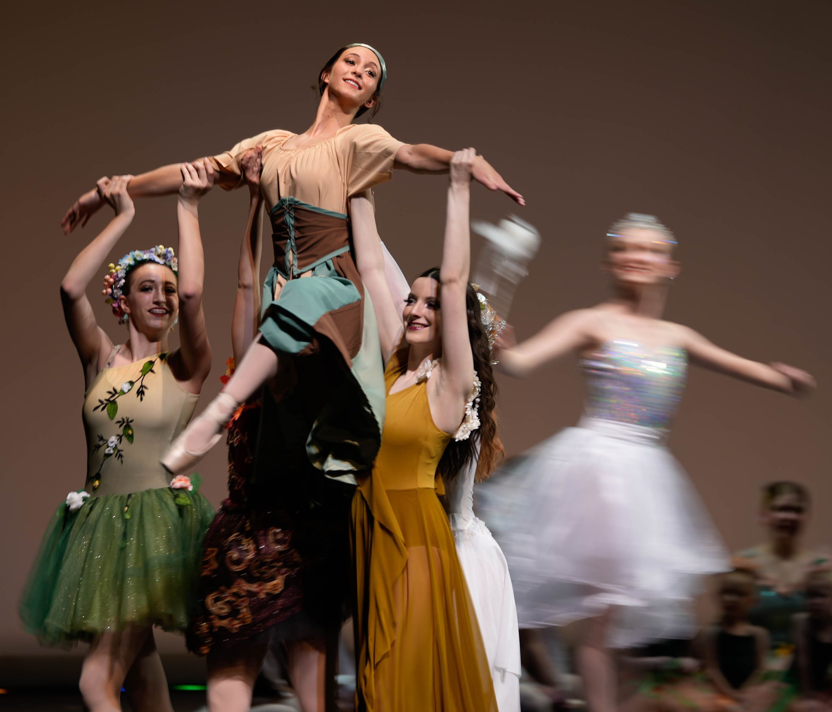 (Francisco Kjolseth | The Salt Lake Tribune) Sophia Camargo, a 15-year-old Grantsville High School freshman, is lifted by fellow dancers with the Tooele Academy of Dance during her lead in the production of “Cinderella” at the Rose Wagner Theater on Monday, May 1, 2023. Camargo is also a recent convert to the sport of wrestling. 