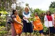 (The Church of Jesus Christ of Latter-day Saints) Relief Society General President Camille Johnson holds radishes as she speaks with women at a garden in Chimaltenango, Guatemala, on May 31, 2024. President Johnson visited Guatemala to observe some of the work initiated by the church to help women and children.