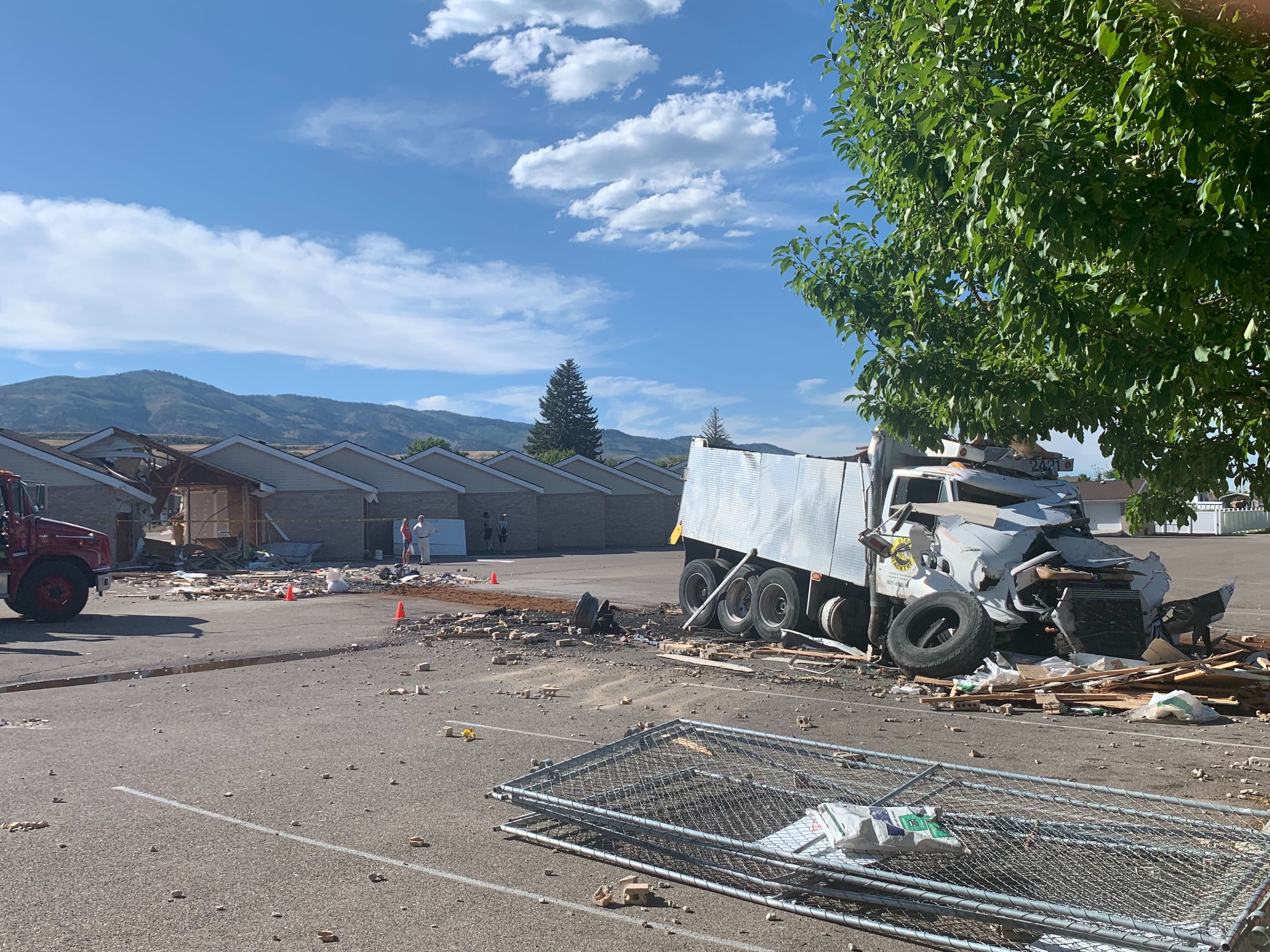 (John Franchi | FOX 13 News) A wrecked truck rests near a condo complex where it crashed into buildings in Garden City on Aug. 20, 2019.