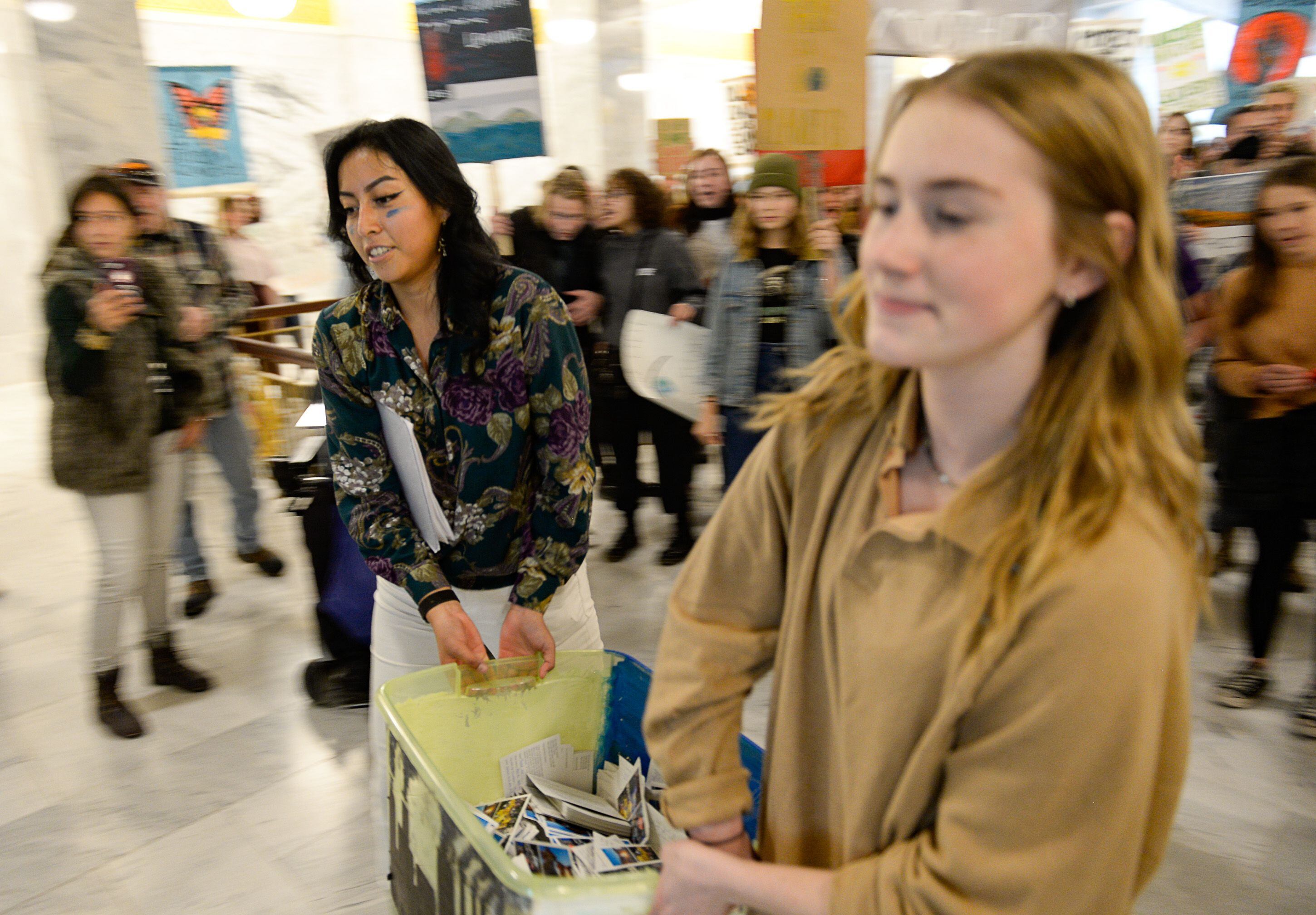 (Francisco Kjolseth | The Salt Lake Tribune) Raquel Juarez, left, and Nina Serafin, are joined by numerous other students outside the office of Gov. Gary Herbert on the Utah Capitol on Friday, Dec. 6, 2019, as they deliver over 4,000 written cards with the importance of protecting Utah lands and clean air solutions. Because of security reasons they were told they would have to mail the cards instead. Fridays For Future, Utah Youth Environmental Solutions, and partners strike in opposition to UtahÕs final oil and gas lease sale of 2019 that will auction off public lands and further fossil fuel development.