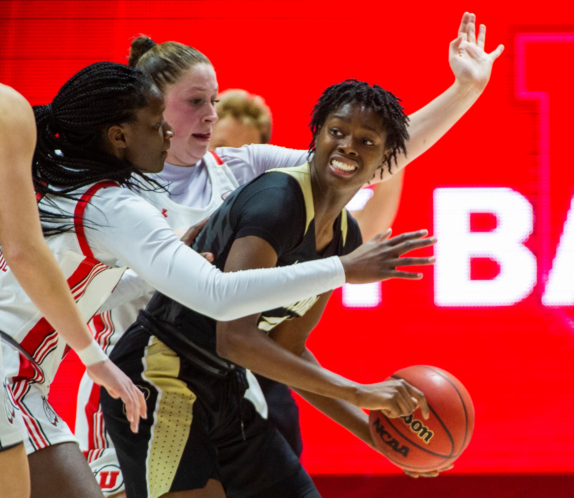 (Rick Egan | The Salt Lake Tribune) Colorado Buffaloes guard Mya Hollingshed (21) looks to pass as he is pressured by the Utah defense, in PAC-12 basketball action between the Utah Utes and the Colorado Buffaloes, at the Jon M. Huntsman Center, Sunday, Nov. 29, 2019.