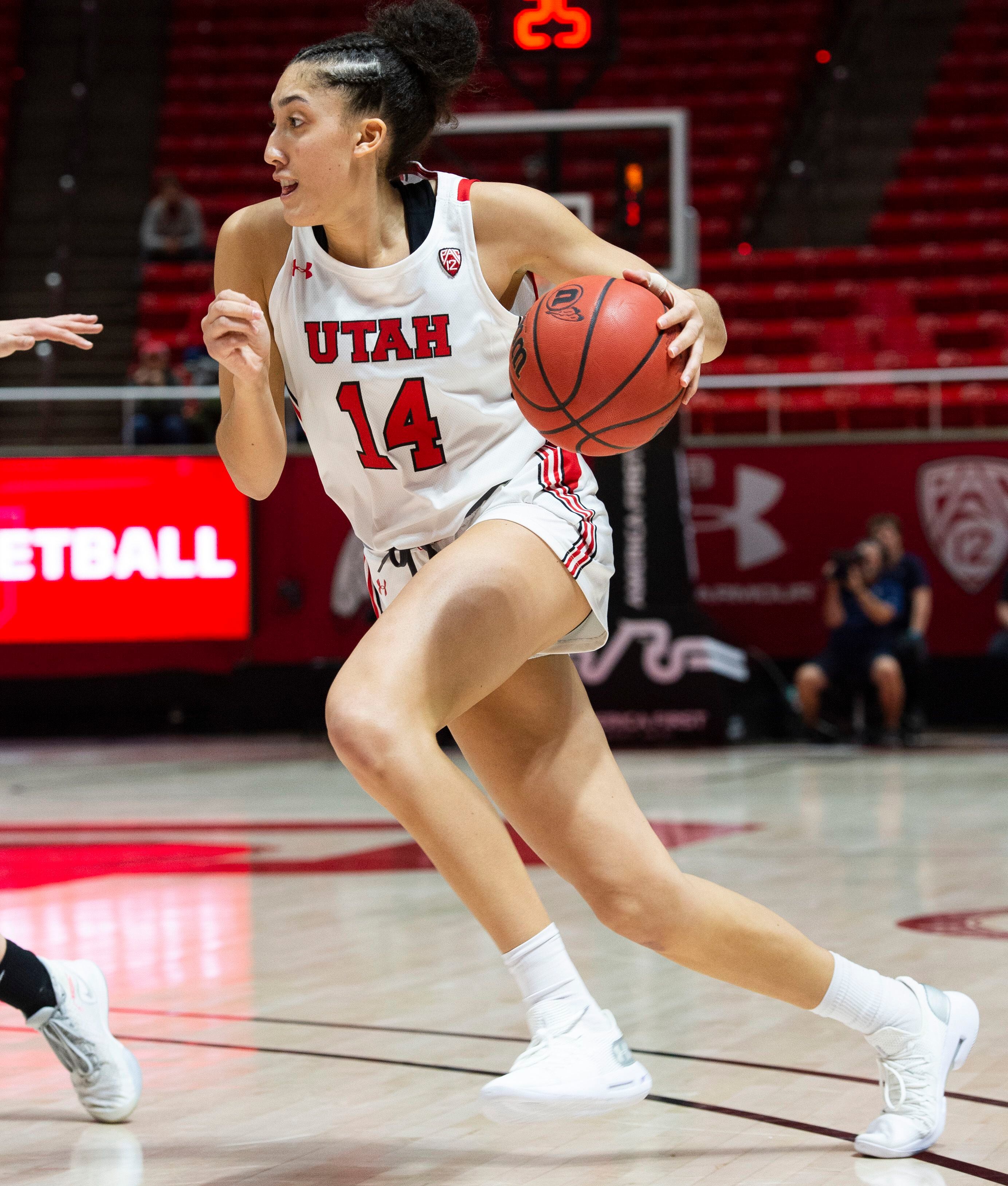 (Rick Egan | The Salt Lake Tribune) Utah Utes guard Niyah Becker (14) takes the ball inside, in PAC-12 basketball action between the Utah Utes and the Colorado Buffaloes, at the Jon M. Huntsman Center, Sunday, Nov. 29, 2019.