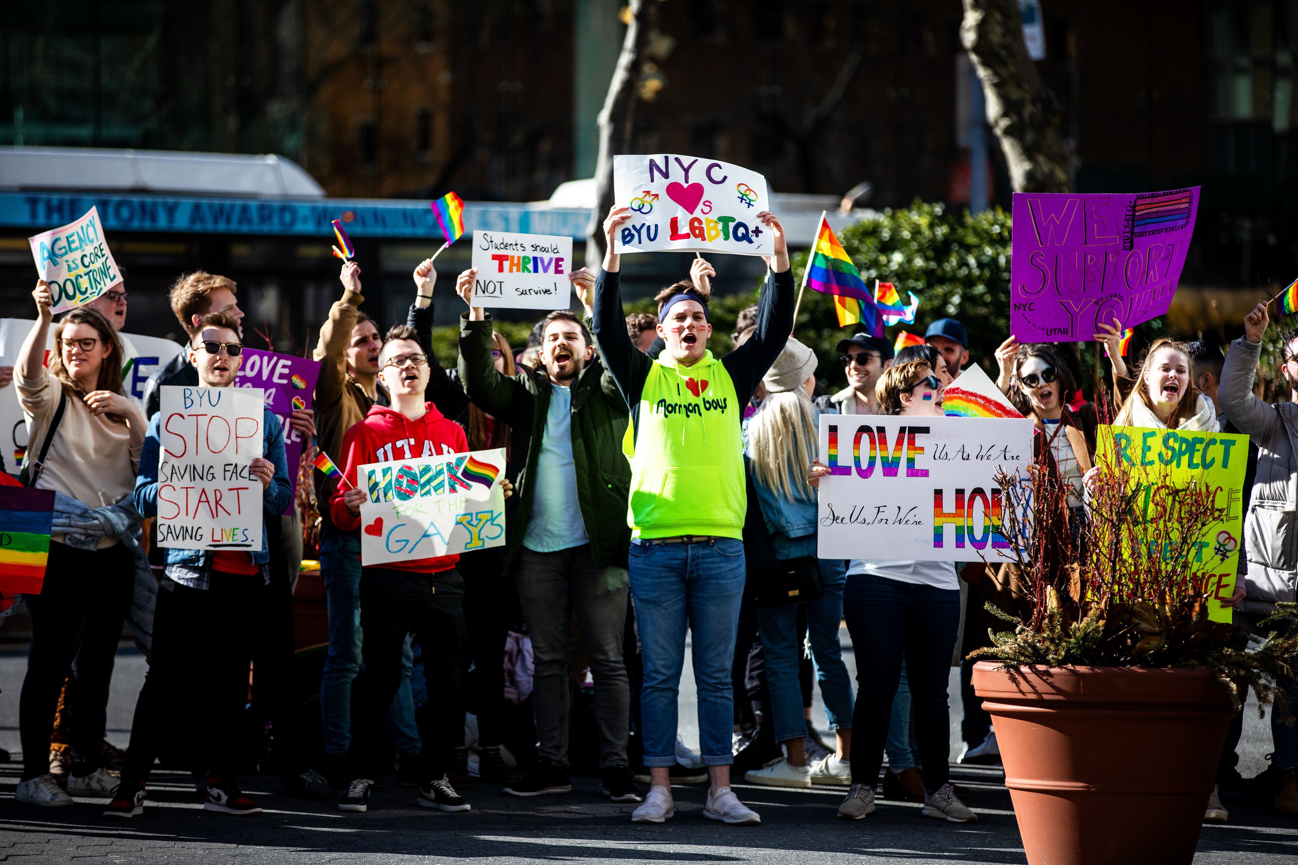 (Demetrius Freeman | for The Salt Lake Tribune) Current and former members of the Church of Jesus Christ of Latter-day Saints, the LGBTQ+ community, and supporters gather at Lincoln square across from the Mormon temple in Manhattan, New York, on March 7, 2020, to stand in solidarity with LGBTQ+ students who attending Brigham Young University. Brigham Young University reinstated homophobic policies in their student handbook that prohibit Òhomosexual behavior.Ó