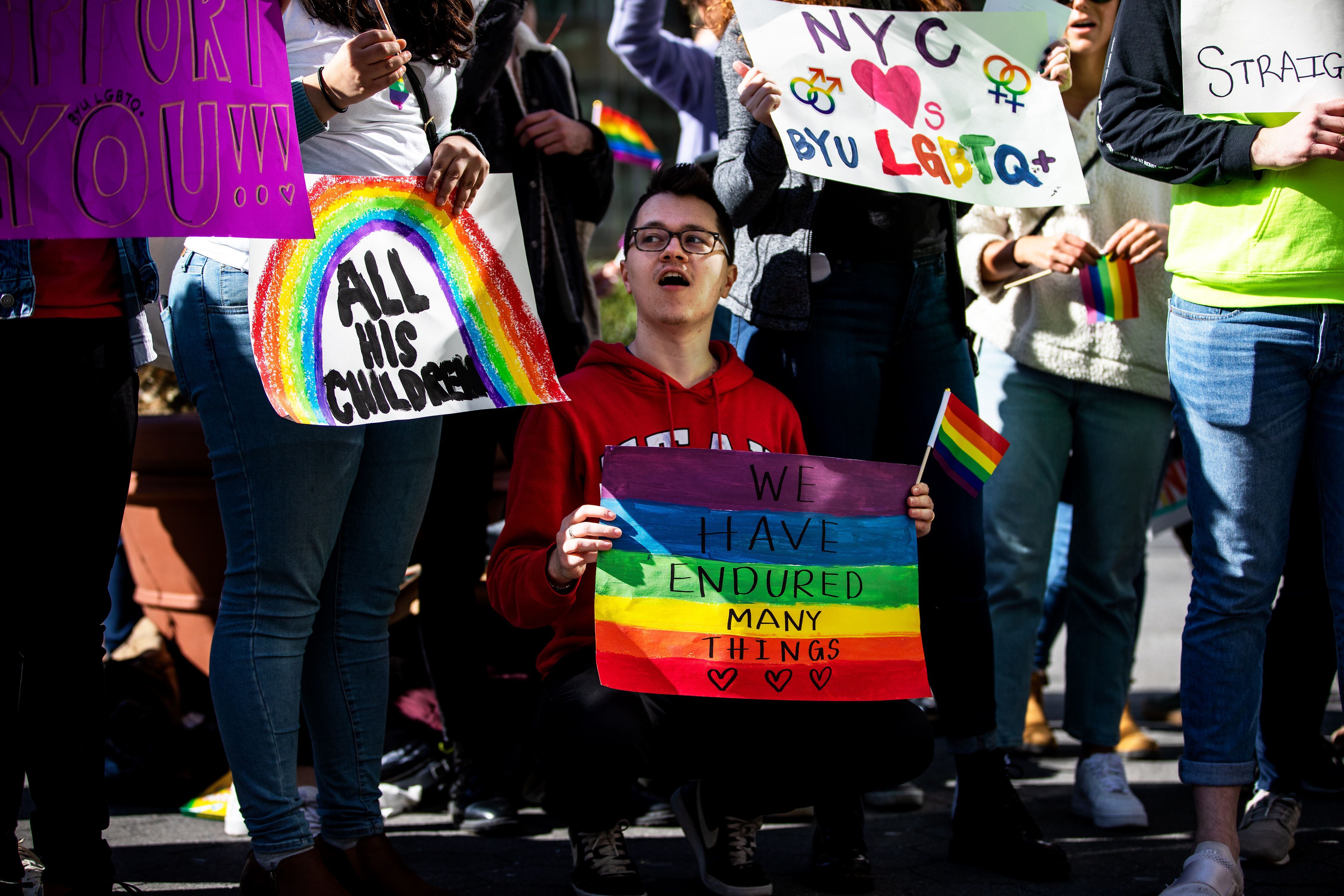 (Demetrius Freeman | for The Salt Lake Tribune) Browne Sebright, 24, chant with current and former members of the Church of Jesus Christ of Latter-Day Saints, the LGBTQ+ community, and supporters gather at Lincoln square across from the Mormon temple in Manhattan, New York, on March 7, 2020, to stand in solidarity with LGBTQ+ students who attending Brigham Young University. Brigham Young University reinstated homophobic policies in their student handbook that prohibit Òhomosexual behavior.Ó