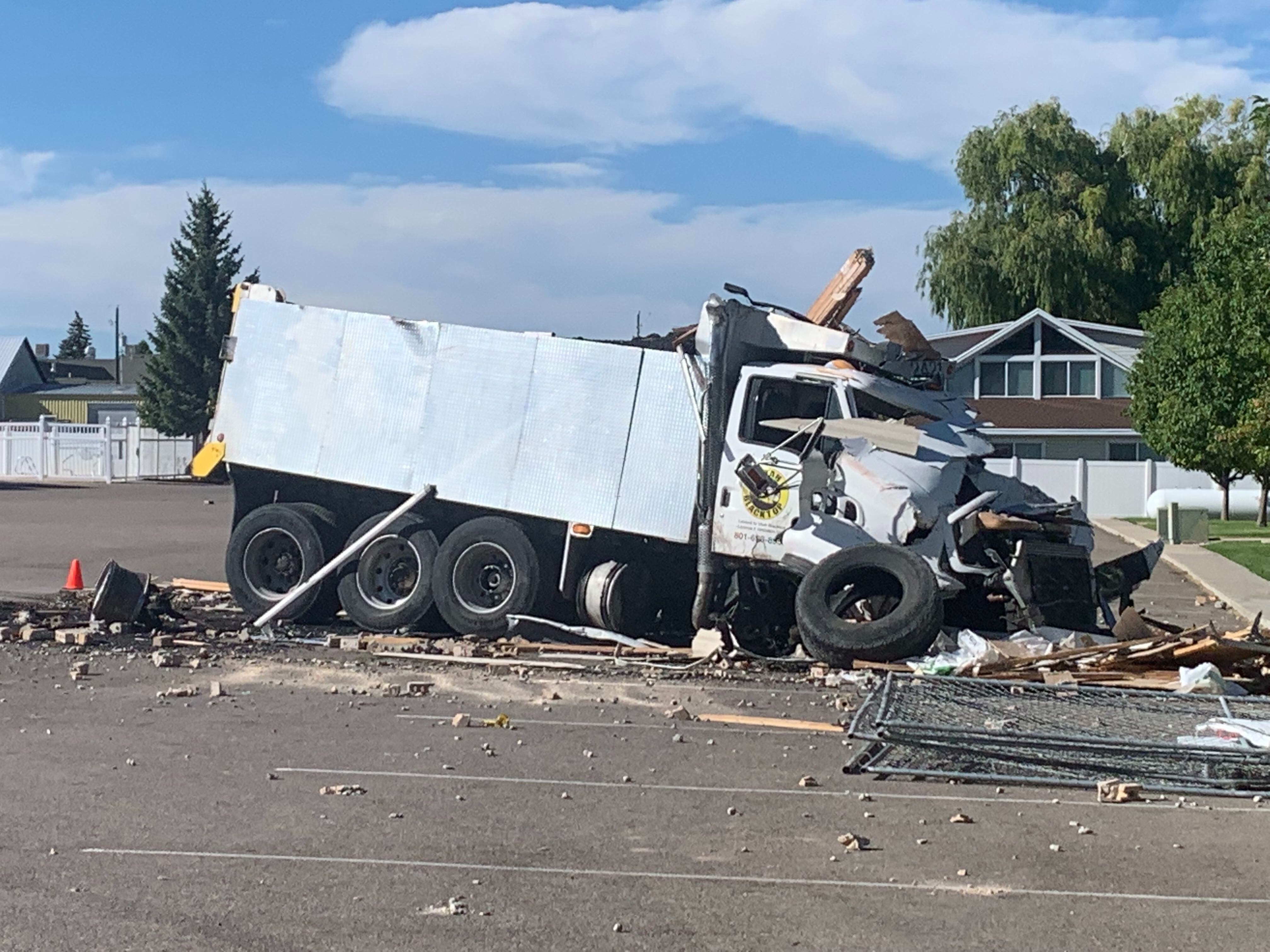 (John Franchi | FOX 13 News) A wrecked truck rests near a Garden City condo complex where it crashed into some of the buildings on Aug. 20, 2019.