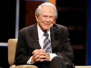 (Steve Helber | AP file photo) Rev. Pat Robertson poses a question to a Republican presidential candidate during a forum at Regent University in Virginia Beach, Va., Oct. 23, 2015. Robertson, a religious broadcaster who turned a tiny Virginia station into the global Christian Broadcasting Network, tried a run for president and helped make religion central to Republican Party politics in America through his Christian Coalition, has died. He was 93. Robertson's death Thursday, June 8, 2023 was announced by his broadcasting network.