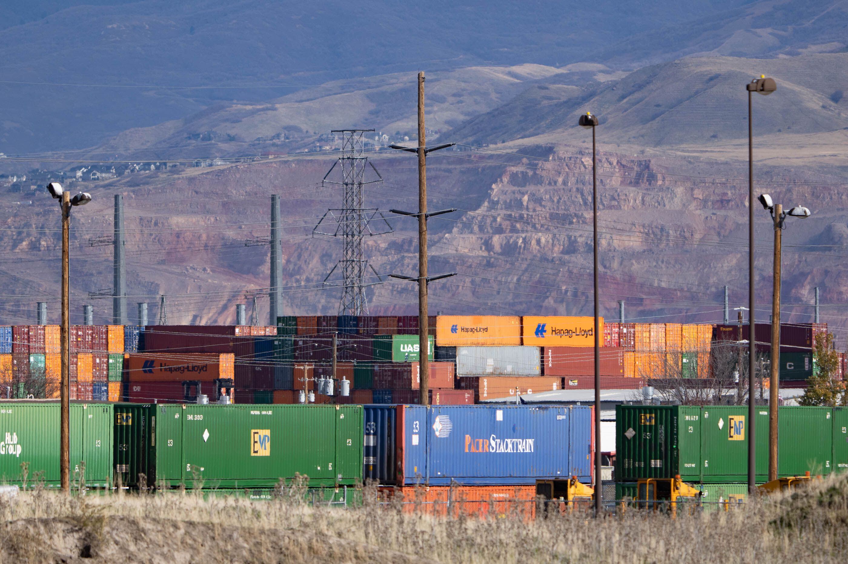 (Francisco Kjolseth | The Salt Lake Tribune) Trucks carrying shipping containers move in and out of the Union Pacific intermodal terminal at a steady pace, west of Salt Lake City. Directly south is the future site of the transloading facility, which will be the heart of the inland port, as seen on Wednesday, Nov. 10, 2021.