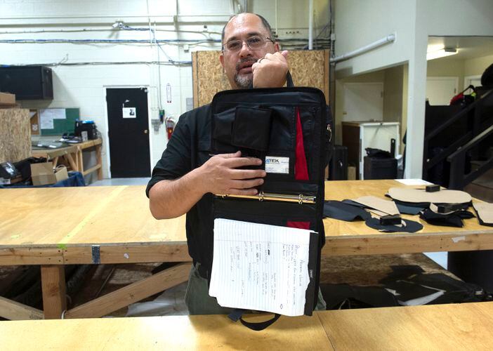 This laptop bag doubles as a bulletproof shield - Kevlar lining