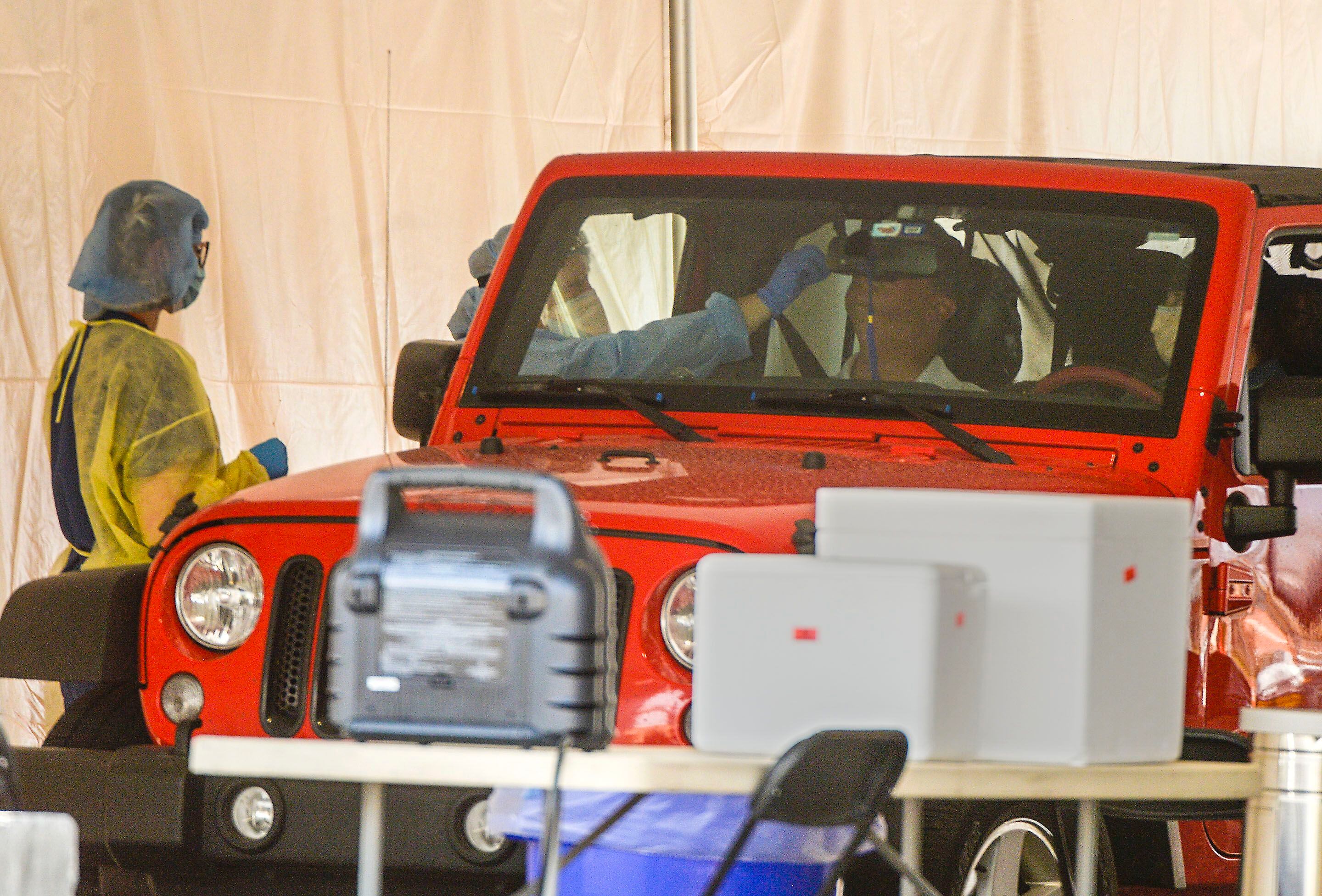 (Leah Hogsten | The Salt Lake Tribune) COVID-19 health care workers at Ogden Regional Medical Center test possible virus carriers in the hospital parking lot drive-thru tent, April 29, 2020.