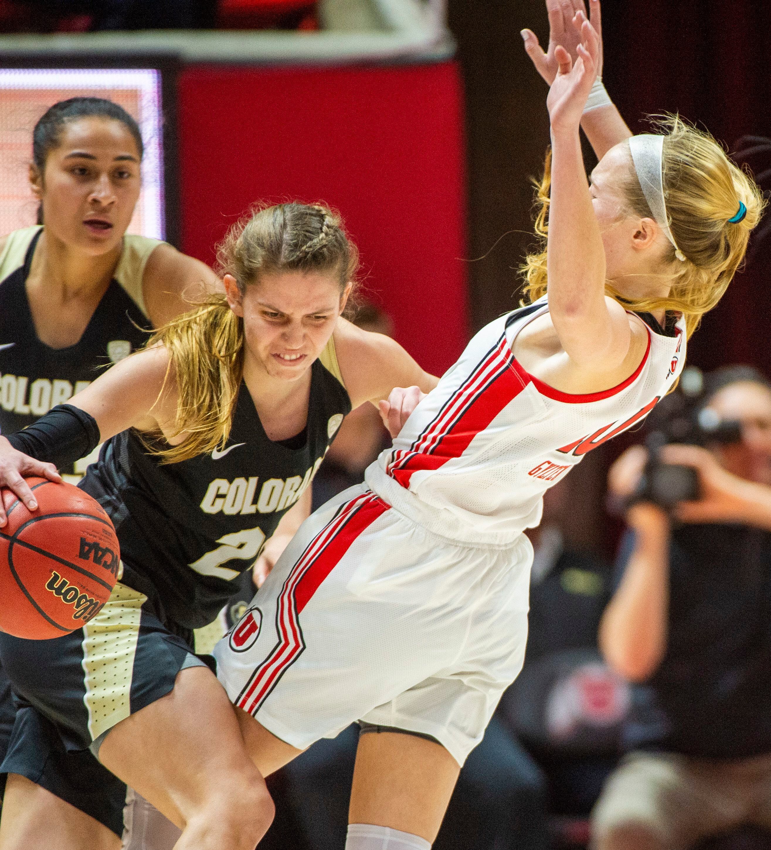 (Rick Egan | The Salt Lake Tribune) Colorado Buffaloes guard Mya Hollingshed (21) is called for an offensive foul, as she collides with Utah guard Dru Gylten (10), in PAC-12 basketball action between the Utah Utes and the Colorado Buffaloes, at the Jon M. Huntsman Center, Sunday, Nov. 29, 2019.