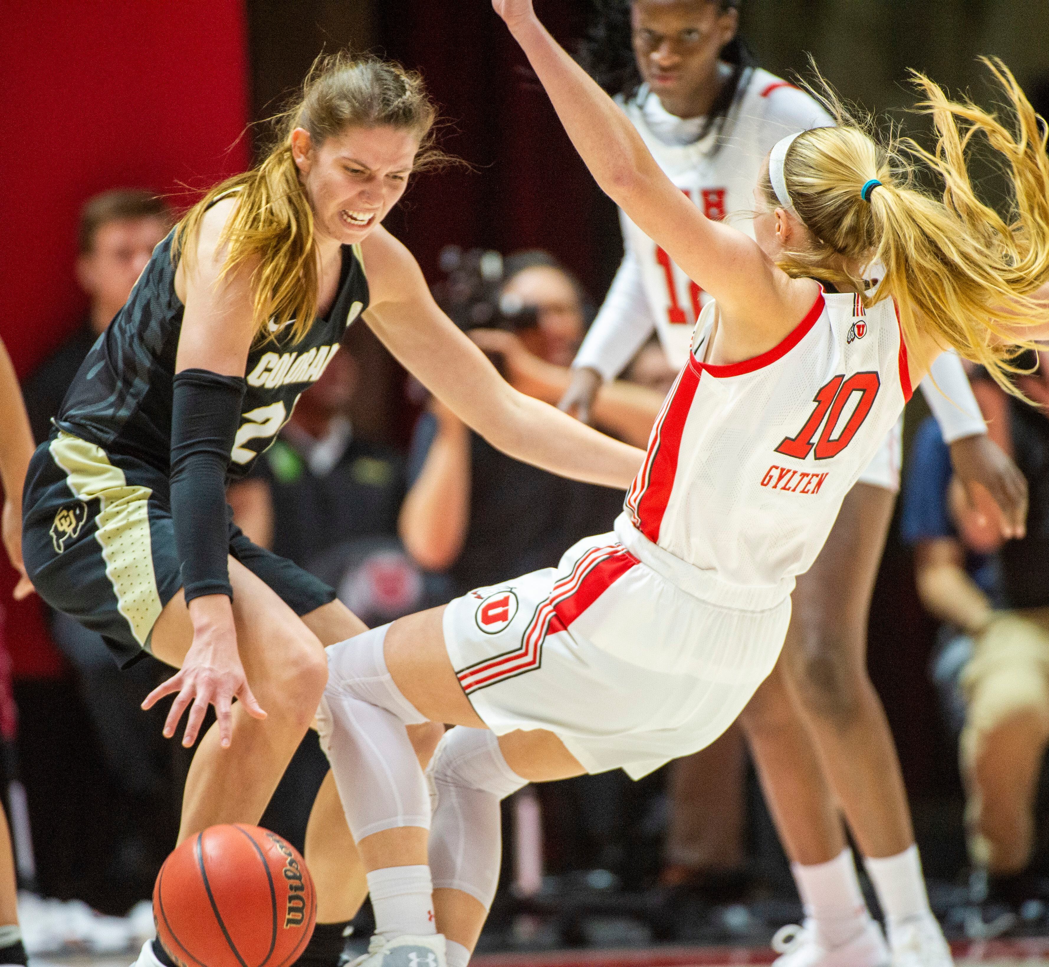 (Rick Egan | The Salt Lake Tribune) Colorado Buffaloes guard Mya Hollingshed (21) is called for an offensive foul, as she collides with Utah guard Dru Gylten (10), in PAC-12 basketball action between the Utah Utes and the Colorado Buffaloes, at the Jon M. Huntsman Center, Sunday, Nov. 29, 2019.