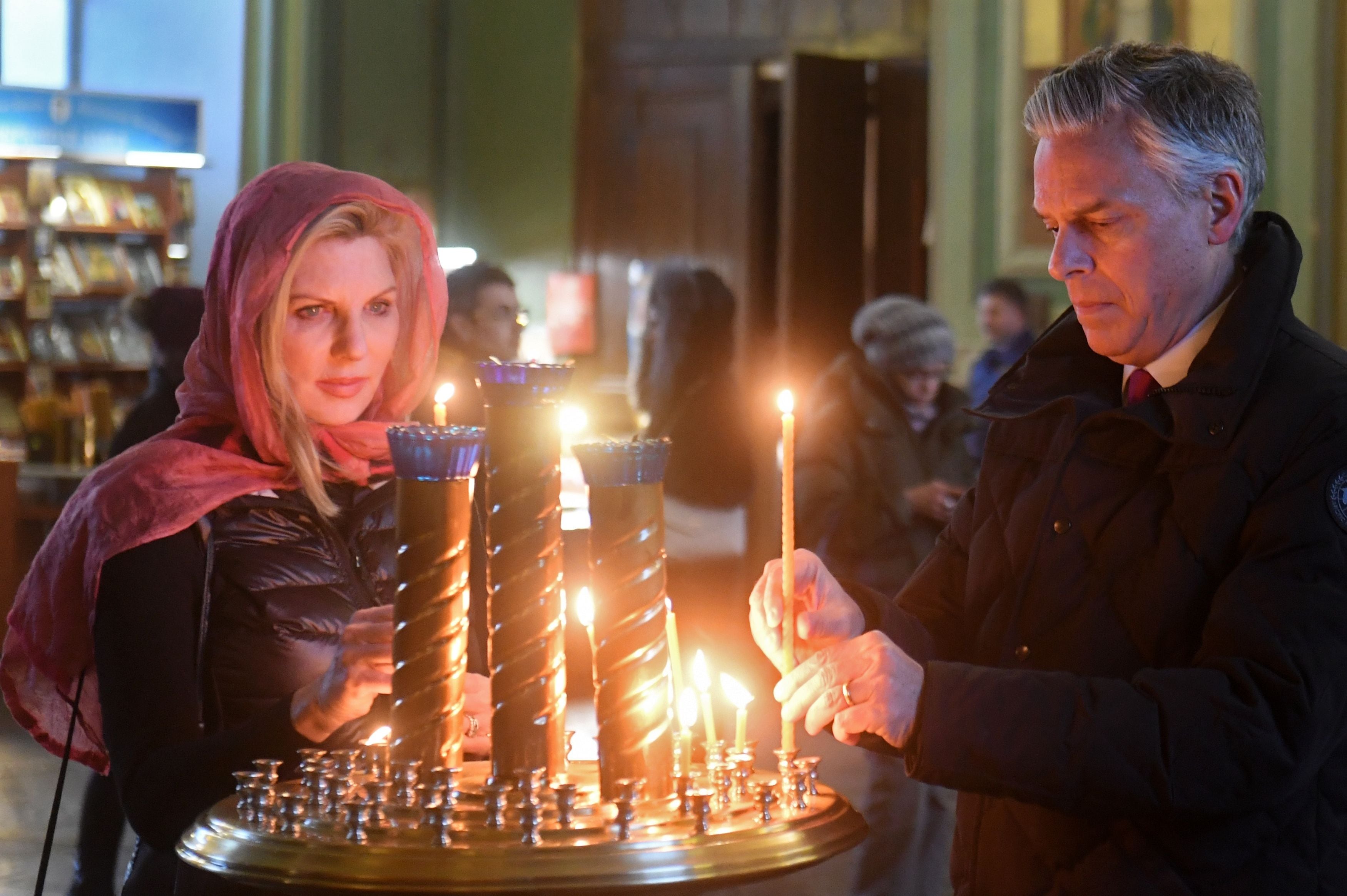 (Maksim Bogodvid | Sputnik via AP) U.S. Ambassador to Russia Jon Huntsman and his wife Mary Kaye Huntsman visit the Annunciation Cathedral as they tour the Kazan Kremlin on Feb. 26, 2018. The former ambassador was one of 500 Americans banned from traveling to Russia on Friday.