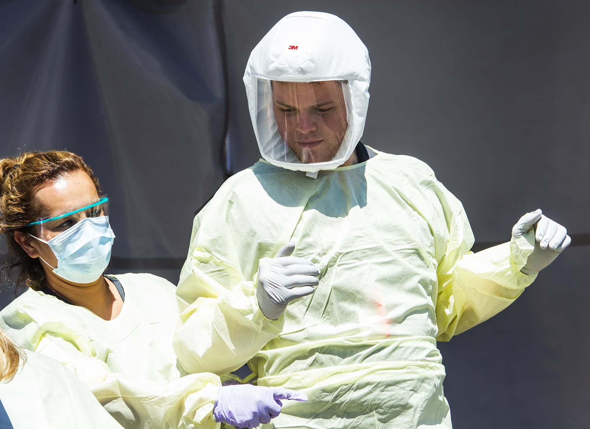 (Rick Egan | The Salt Lake Tribune) Medical assists prepare for the next patient, at the Intermountain Healthcare Coronavirus Mobile Testing Unit at Utah Valley Hospital in Provo, Friday May 8, 2020.