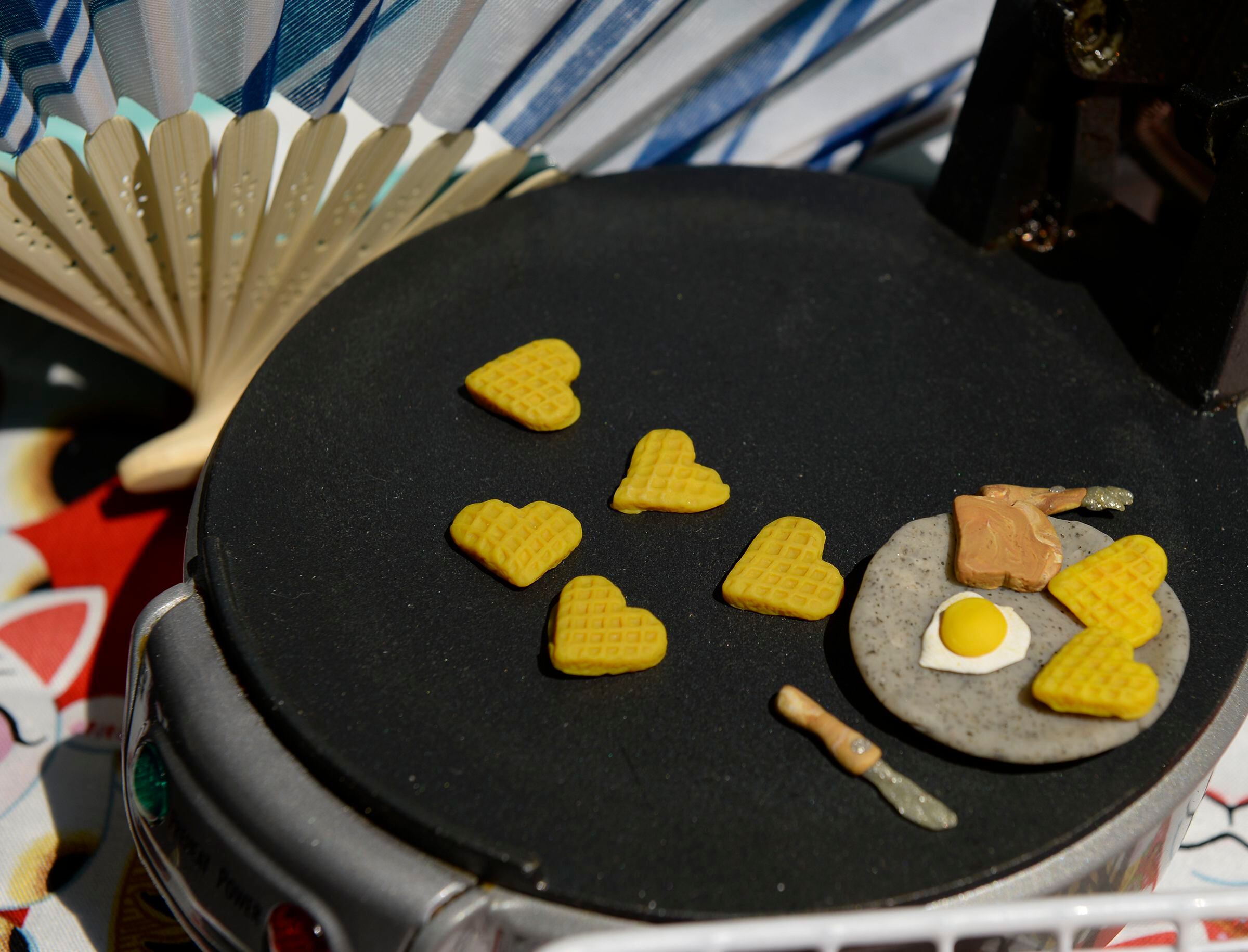 (Leah Hogsten | The Salt Lake Tribune) Imogen Nesse, 9, of Salt Lake City creates reproductions of food, including sushi, fudgesicles, cupcakes and heart-shaped waffles out of polymer clay at Craft Lake CityÕs DIY Festival Kid Row, where children 14 and under make and sell their products. Craft Lake CityÕs DIY Festival is UtahÕs largest local, three day arts festival with over 300 artisans, DIY engineers, vintage vendors and craft food creators.