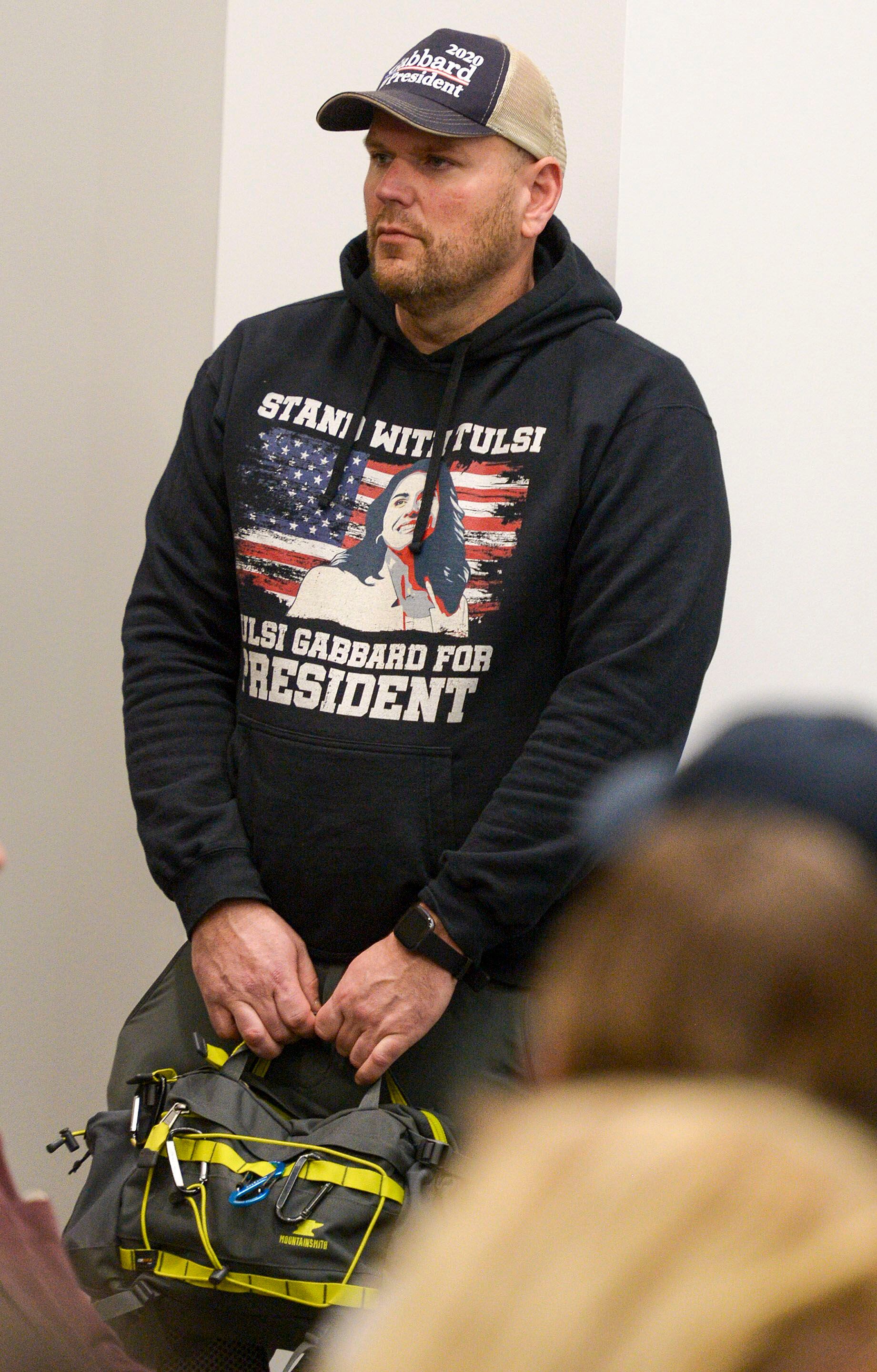 (Leah Hogsten | The Salt Lake Tribune) A supporter of Tulsi Gabbard, U.S. Representative for Hawaii' and Democratic presidential candidate listens as Gabbard delivers her stump speech at a "meet the candidate" event at the University of Utah's Hinckley Institute of Politics, Feb. 21, 2020.