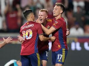 Real Salt Lake's Justen Glad (15) celebrates his goal against Minnesota United withDanny Musovski (17) and Jefferson Savarino (10) during the second half of an MLS soccer match Saturday, June 24, 2023, in Sandy, Utah. (AP Photo/Rick Bowmer)