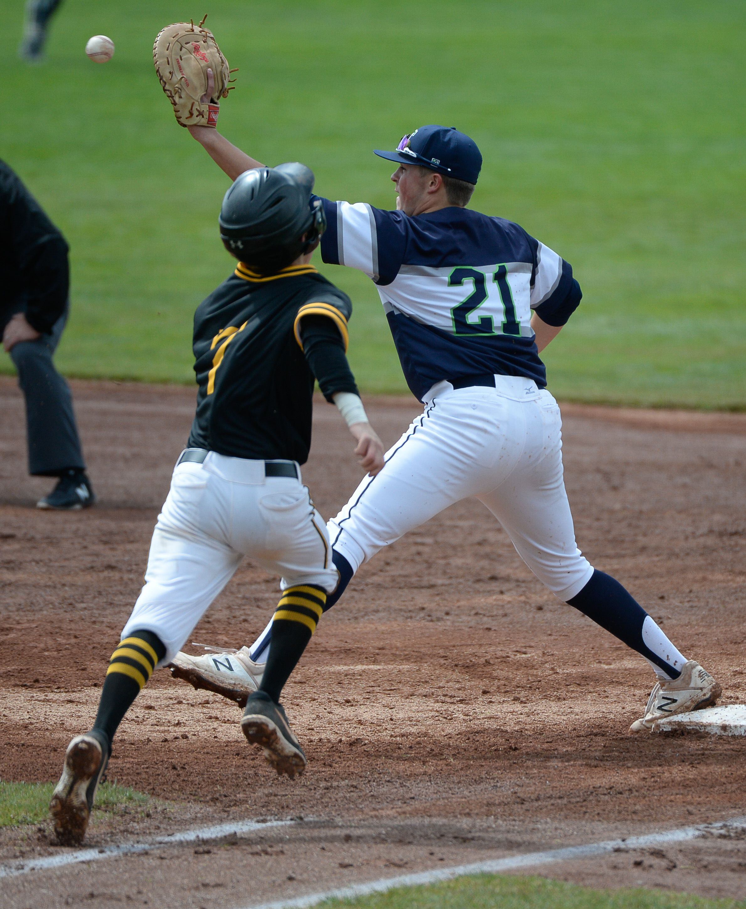 (Francisco Kjolseth | The Salt Lake Tribune) Cottonwood's Cade Perkins comes up short at first as Paxton Richards of Timpanogos pulls in the catch during the 5A baseball championship game at UCCU Stadium on the UVU campus in Orem, Friday, May 24, 2019.