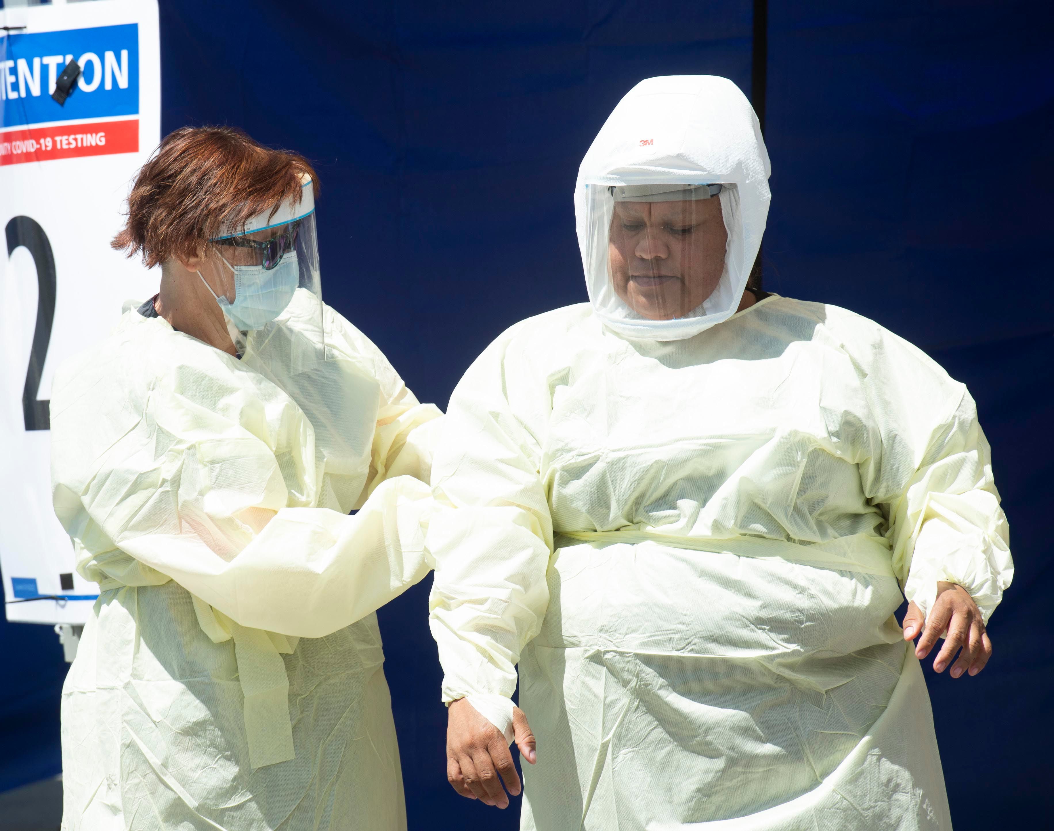 (Rick Egan | The Salt Lake Tribune) Medical assists prepare for the next patient, at the Intermountain Healthcare Coronavirus Mobile Testing Unit at Utah Valley Hospital in Provo, Friday May 8, 2020.