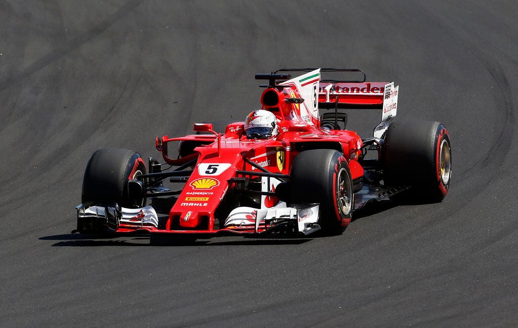 Red Bull driver Sebastian Vettel of Germany celebrates on his car