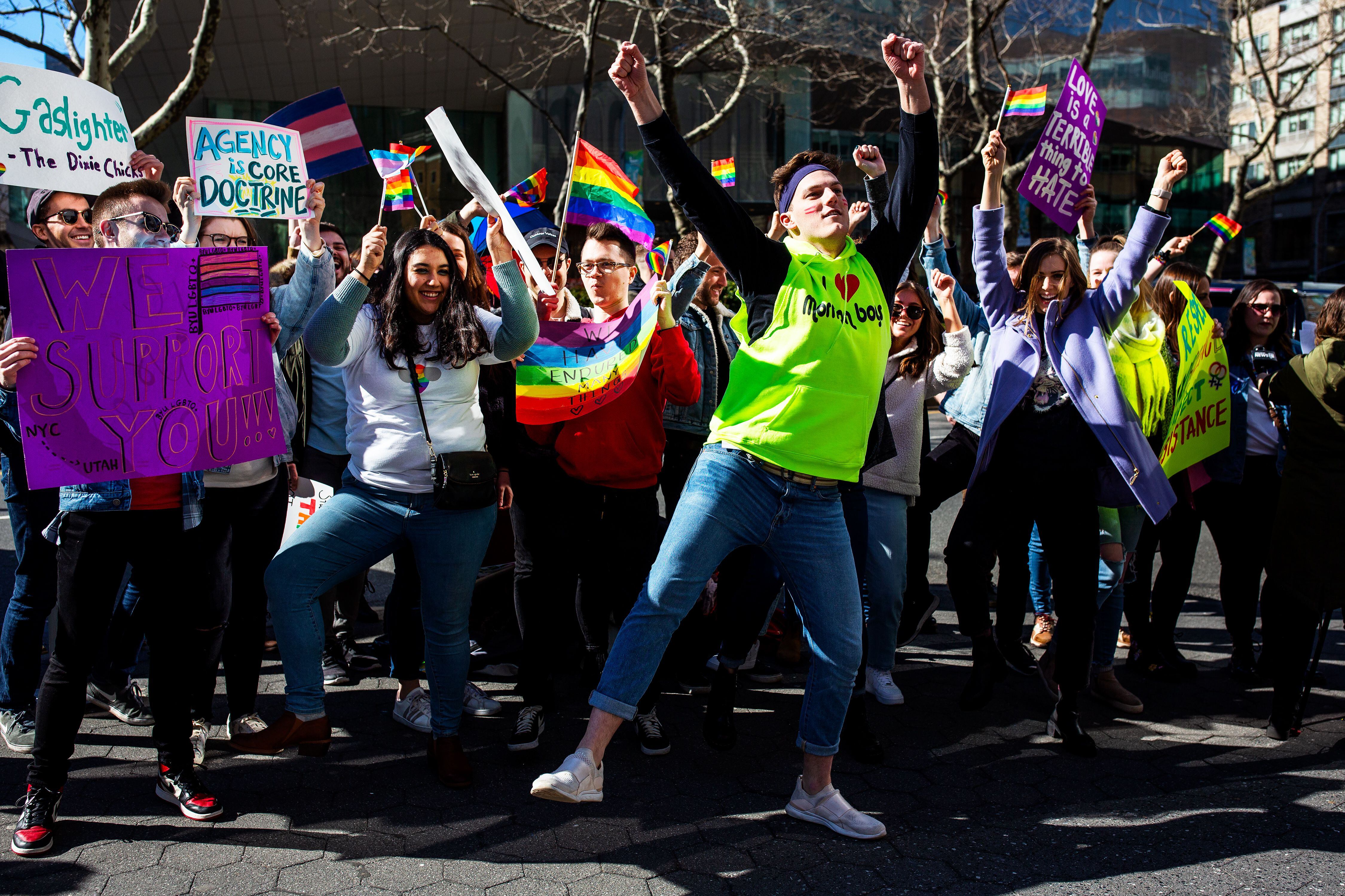 (Demetrius Freeman | for The Salt Lake Tribune) Current and former members of the Church of Jesus Christ of Latter-day Saints, the LGBTQ+ community, and supporters gather at Lincoln square across from the Mormon temple in Manhattan, New York, on March 7, 2020, to stand in solidarity with LGBTQ+ students who attending Brigham Young University. Brigham Young University reinstated homophobic policies in their student handbook that prohibit Òhomosexual behavior.Ó