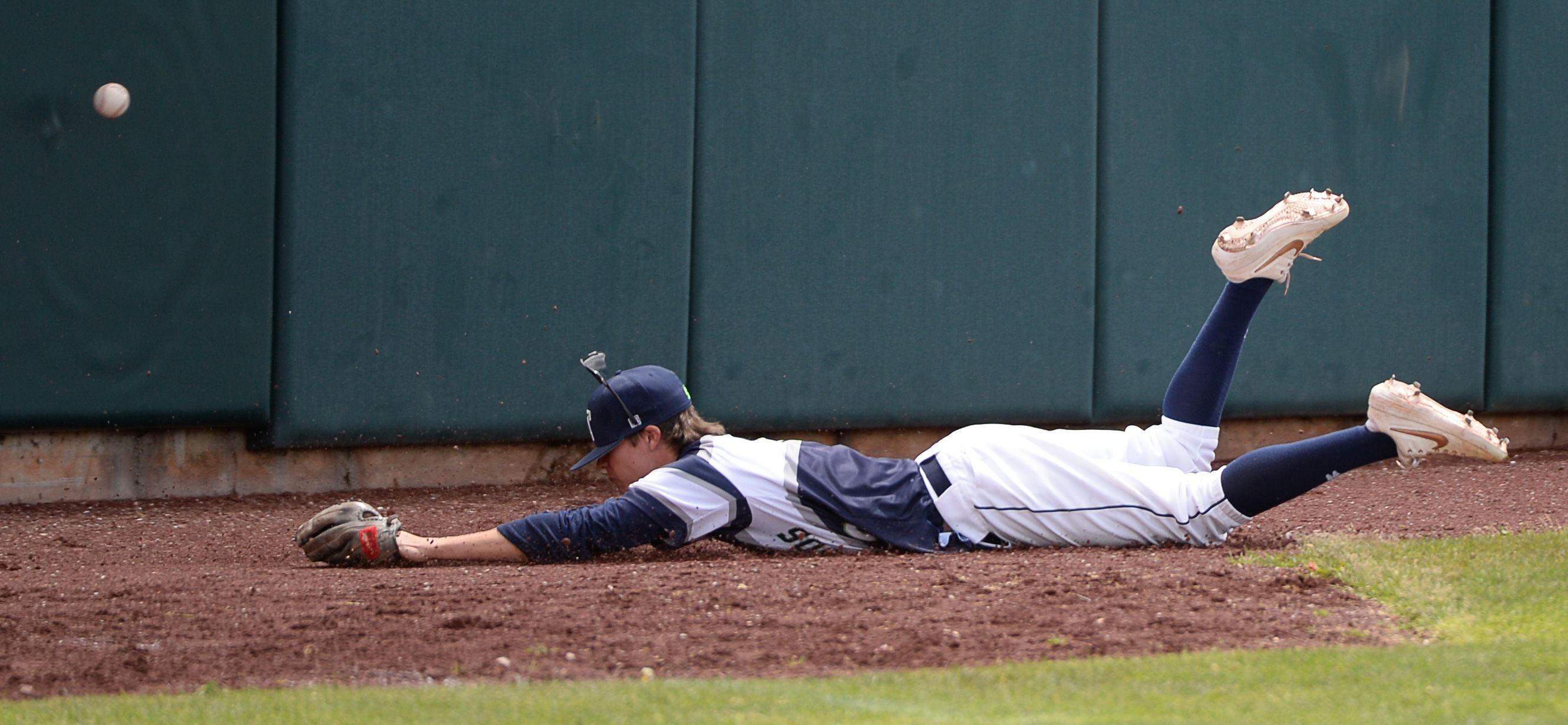 (Francisco Kjolseth | The Salt Lake Tribune) Krew Erickson of Timpanogos stretches out for catch attempt as Cottonwood gains two runs that puts them up 6-5 for the win during the 5A baseball championship game at UCCU Stadium on the UVU campus in Orem, Friday, May 24, 2019.